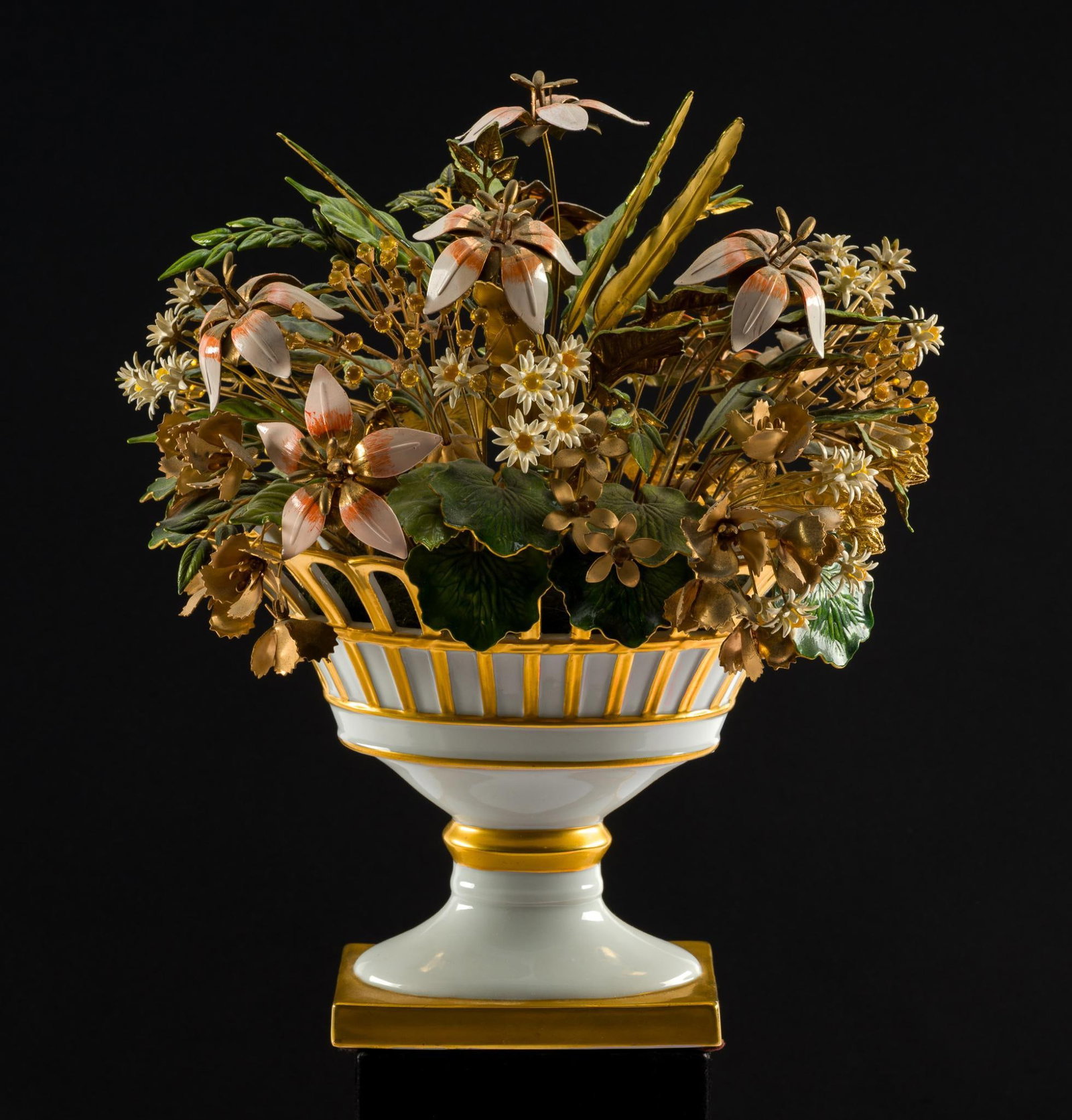 Fleurs Des Siecles by Jane Hutcheson: Sculpture of metal flowers in a porcelain vase. Marked to bottom Designed by Jane Hutcheson for the GIftworld of Gorham. In good condition. Total height ~10-1/2". Vase measures ~7-3/4" L x 5-1/2" H.&#