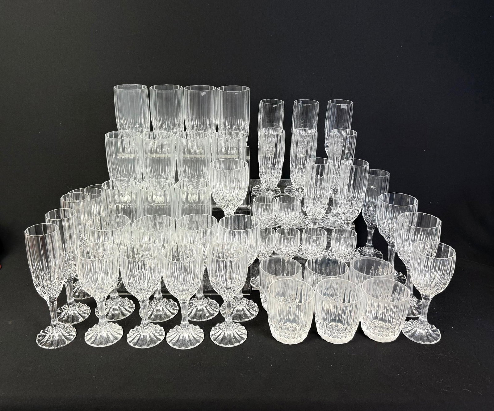 49 Pc Glass Drinkware Service: Some chips. 2" to 3" wide x 4-3/4" to 7-1/2" high. 