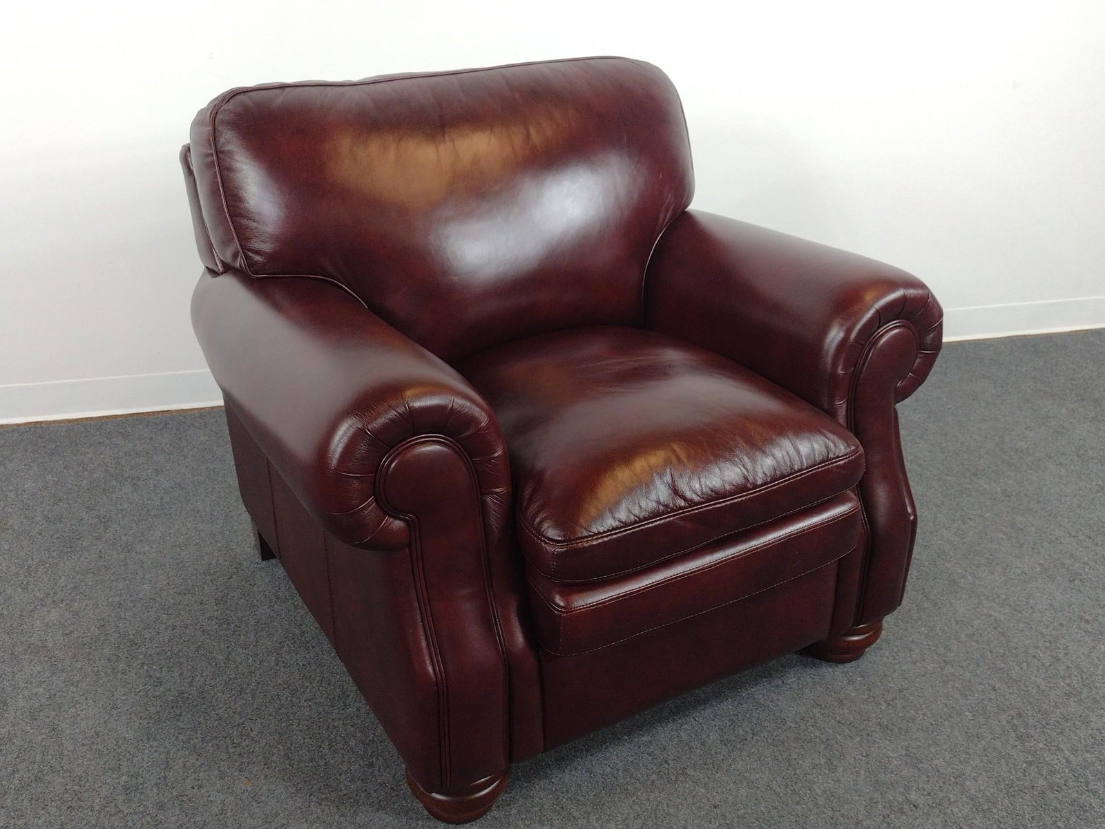 Oversized Faux Leather Arm Chair: 41" wide X 38" deep X 37" high. No manufactures name found.