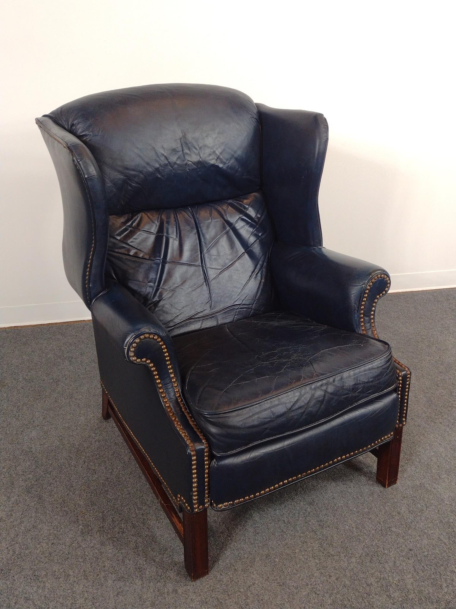Barcalounger Leather Reclining Wing Back Chair: 32" wide X 31" deep X 43" high. Leather has cracks and areas of discoloring.