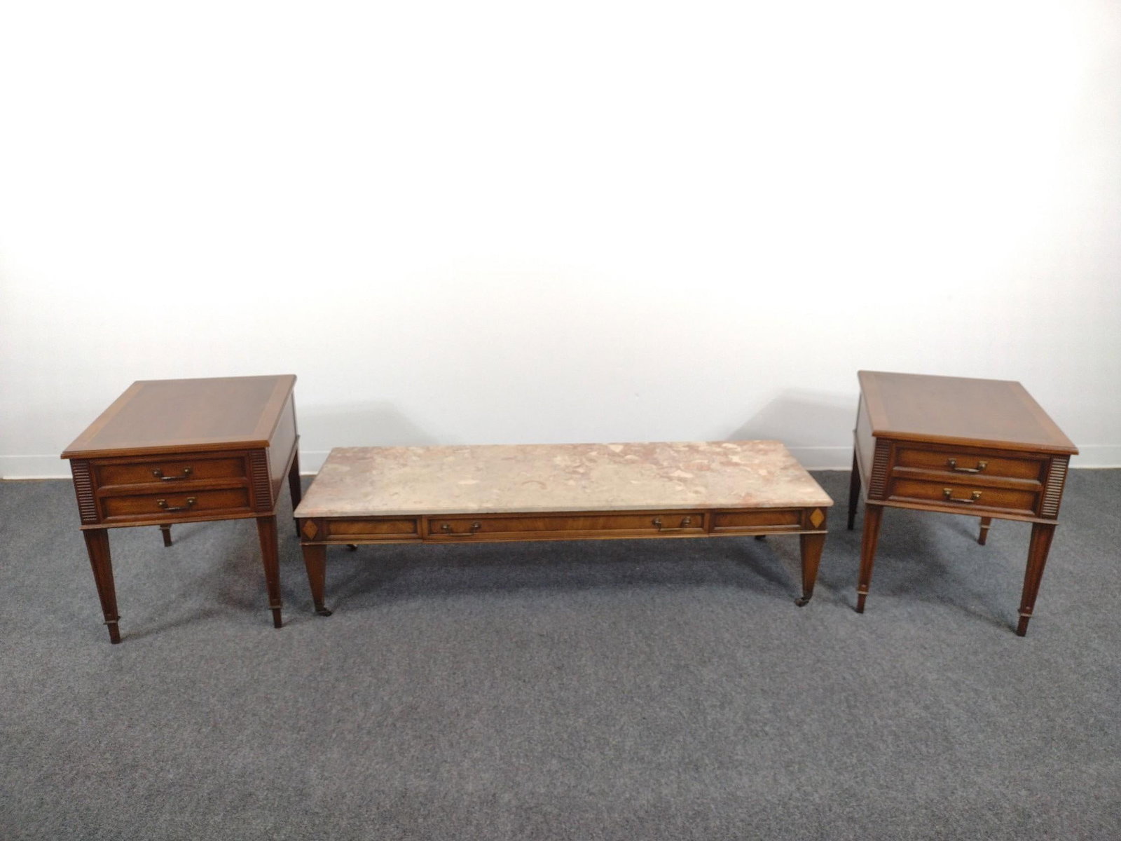 Henredon Marble Top Coffee Table and Pair of End Tables: Coffee Table 60" wide X 20" deep X 14" high. End tables 20" wide X 26" deep X 23" high. All have some light scratches.