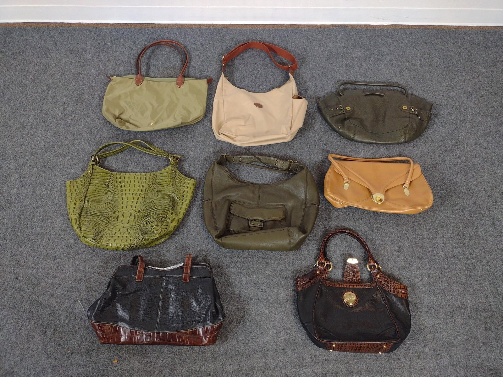 8 Designer Purses: Includes Brahmin, Longchamp, Cole Haan, and more. All in good condition consistent with use. Largest measures 21" long