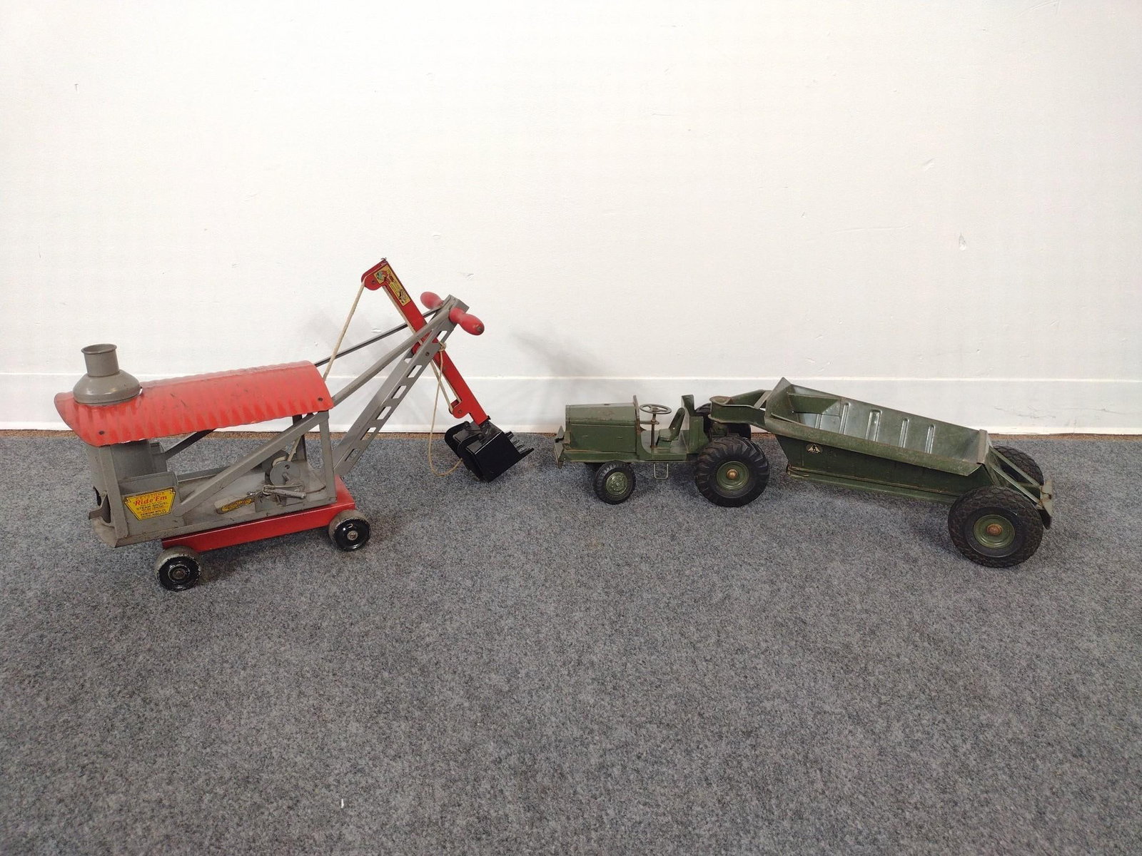 2 Early 20th Century Metal Toys: 1.) Charles WM. Doepke Manufacturing Company "The Pioneer" 2.) Keystone Ride 'Em Steam Shovel. Both in good condition, consistent with age and use. Largest item measures 27" long. 