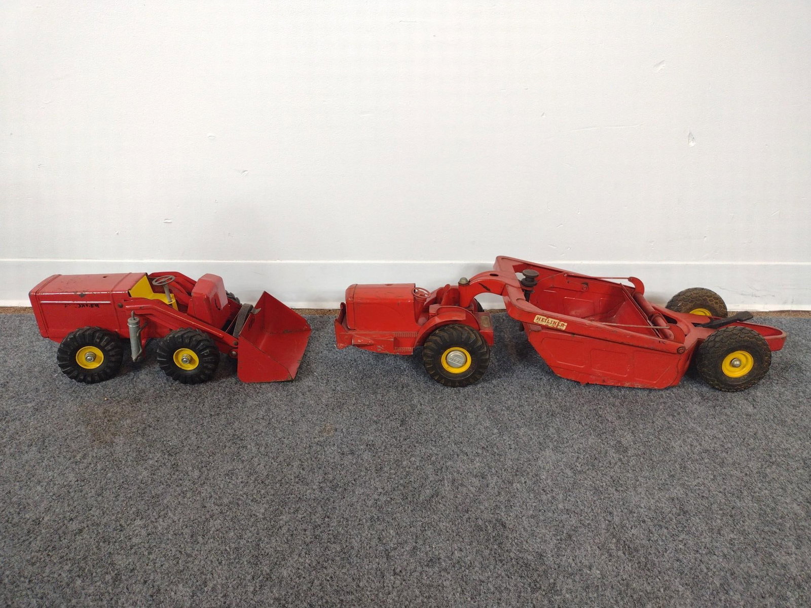 2 Antique Metal Toys: Includes Nylint Red "Payloader" and a Doepke Manufacturing and Co "Heiliner". Both in fair condition. Largest measures ~29-1/4". 