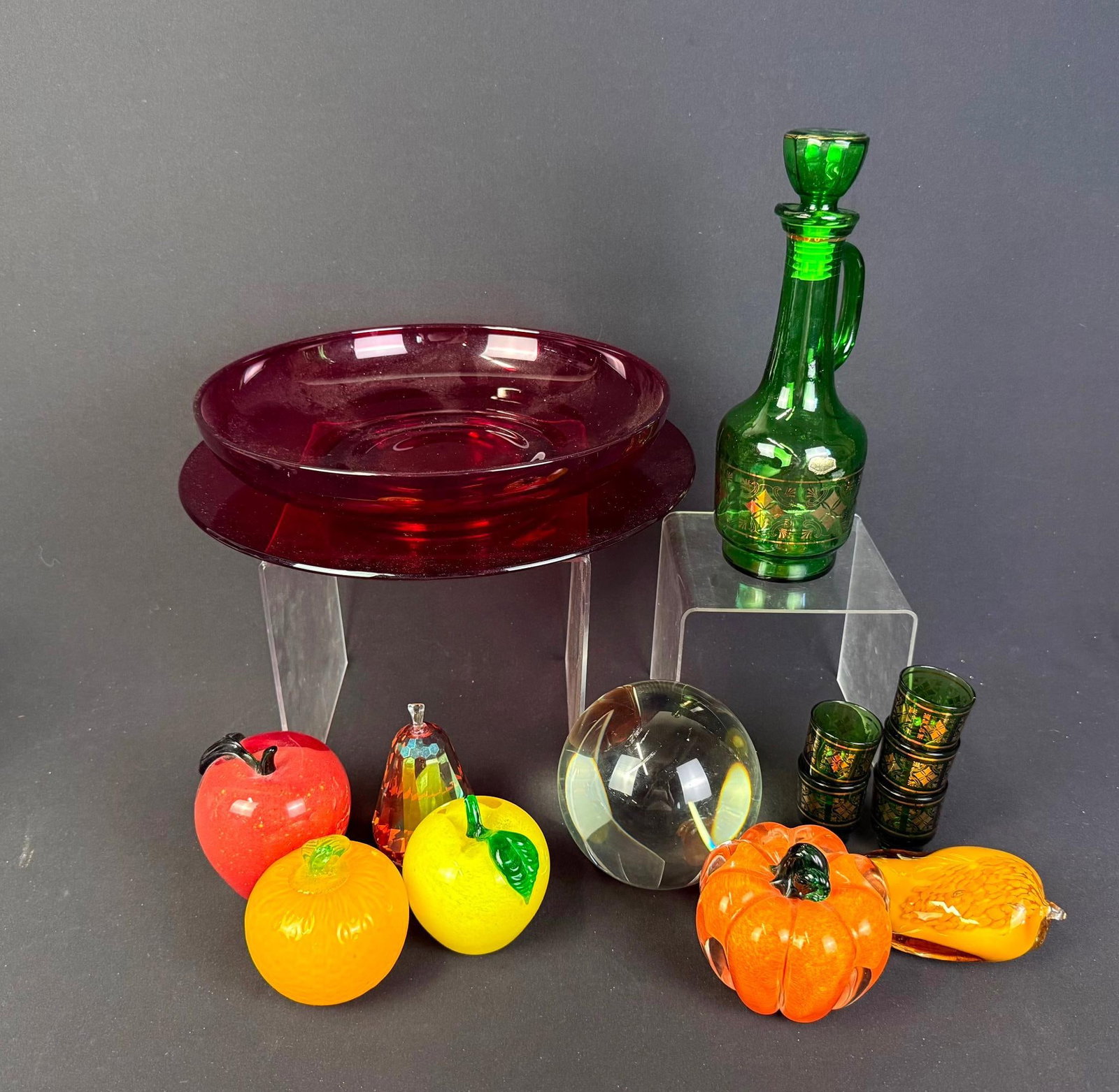 15 Pieces of Glass incl. Lenox and Simon Designs: Also includes glass fruit, center bowl, and decanter. 2" to 12" wide x 2" to 2-1/4" high. 