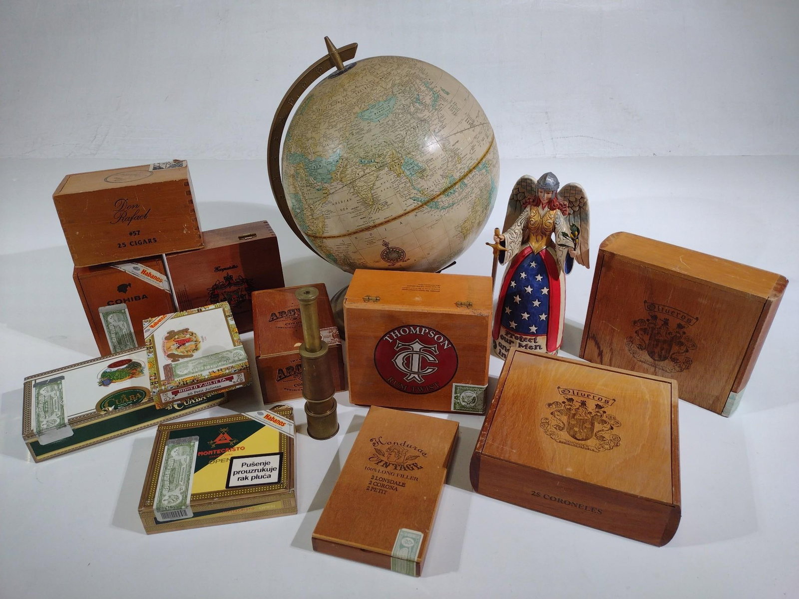 Cigar Boxes, Antique Telescope & World Globe: Includes a Cram's Imperial Globe, a Jim Shore "Protect Those Who Sacrifice and Serve" statue, an antique telescope and 9 cigar boxes including Cuban cigars. Globe measures 13" x 12" x 17" and smallest