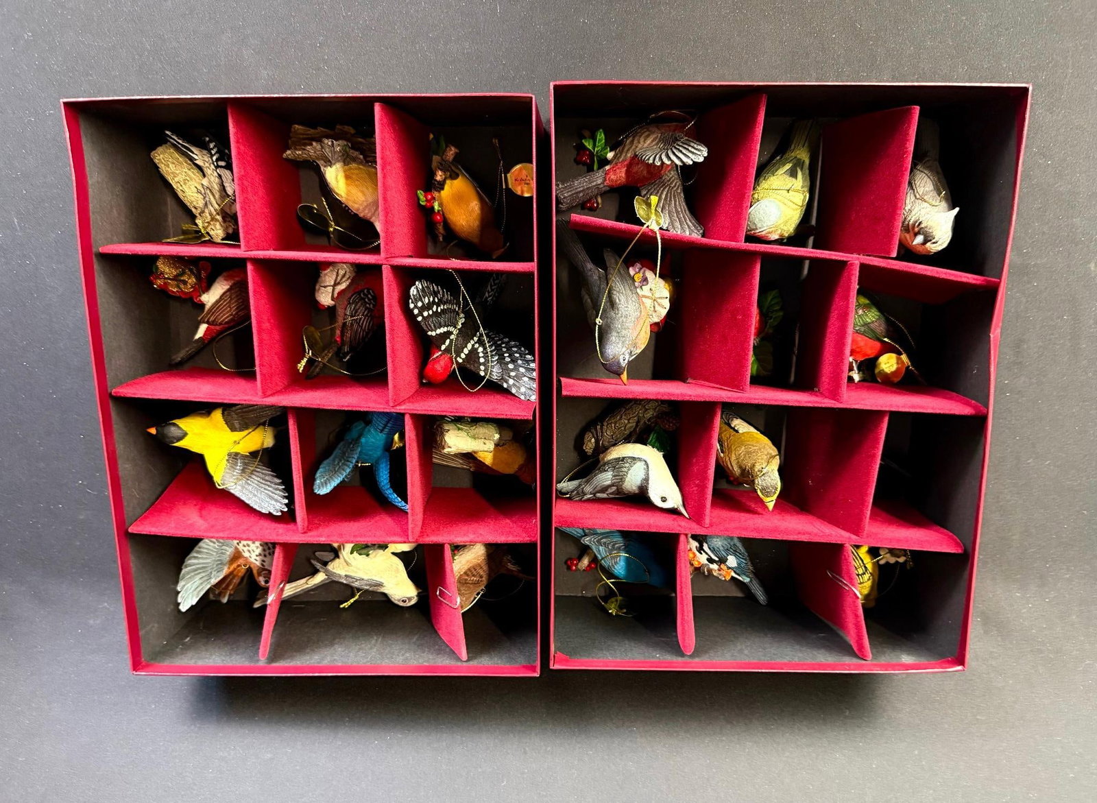 47 Danbury Mint Bird Ornaments: In Danbury Mint storage boxes. Includes cardinal, mountain bluebird, robin, and more. 4-1/8" to 5" wide x 2-1/4" to 2-1/2" high. 