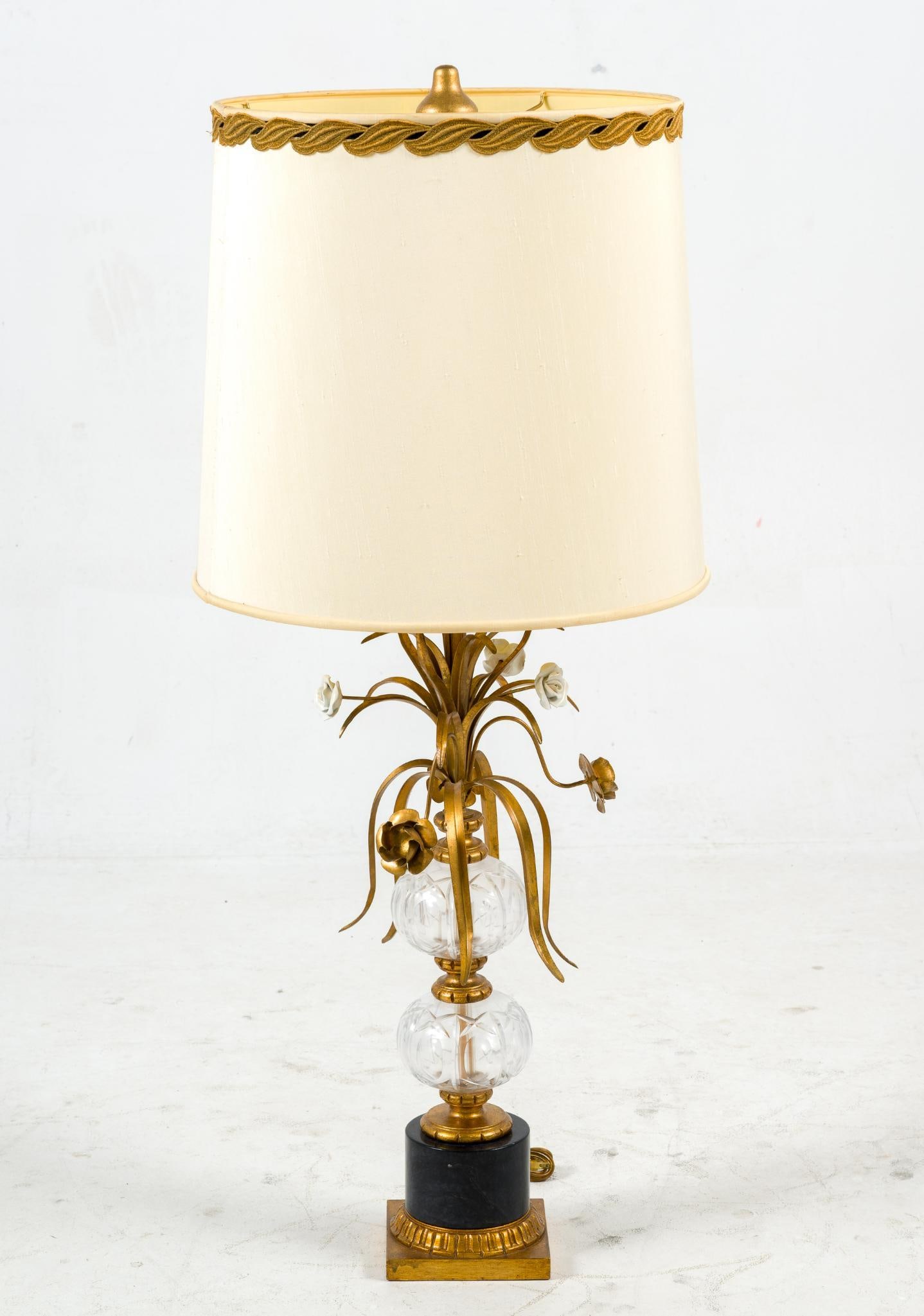 Brass Hollywood Regency Style Lamp: Large brass and glass lamp regency style with floral brass details. In good condition. 45" H x 18.5 V x 18.5 D