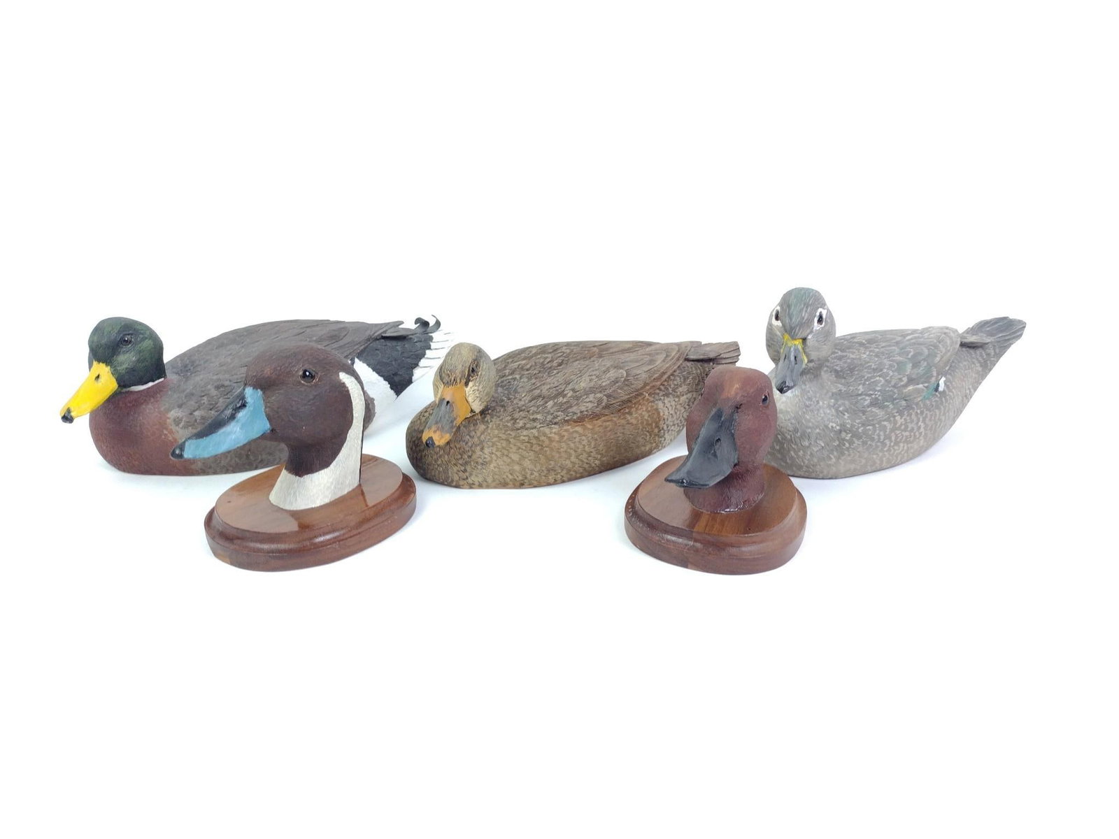 5 Carved Ducks: Three signed Herb Cox and two duck heads, not signed. 4" to 5-1/2" wide x 6" to 11" long x 4" to 4-1/4" high. 