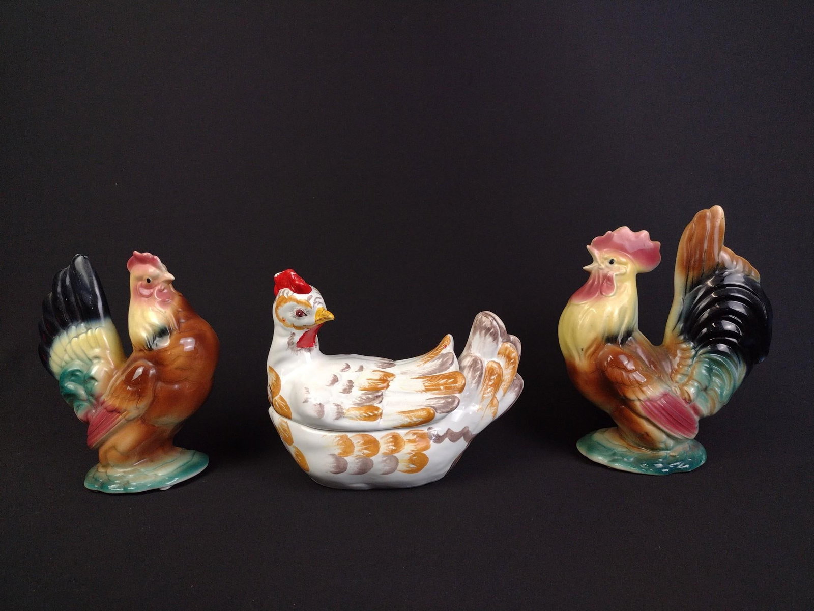 Italian Hen-On-Nest & Rooster with Hen Statues: Chicken tureen stamped "Italy" on the bottom, has some small paint losses to the apex of the hens crown and measures 4-1/4" x 6-1/4" x 8-1/2". Hen and rooster statues both measure approximately