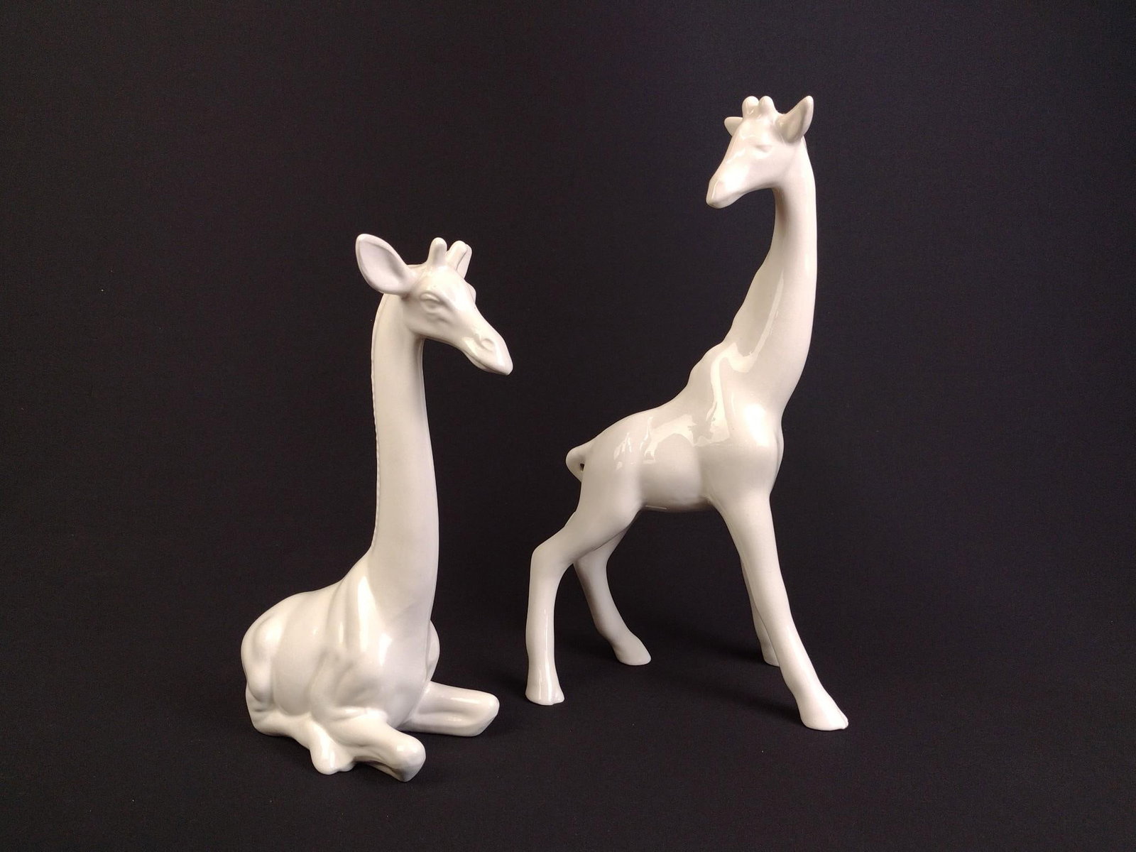 2 Ceramic Giraffe Statues: Kneeling giraffe measures 3-3/4" x 6" x 11-1/2" and the standing giraffe measures 5" x 8" x 15".