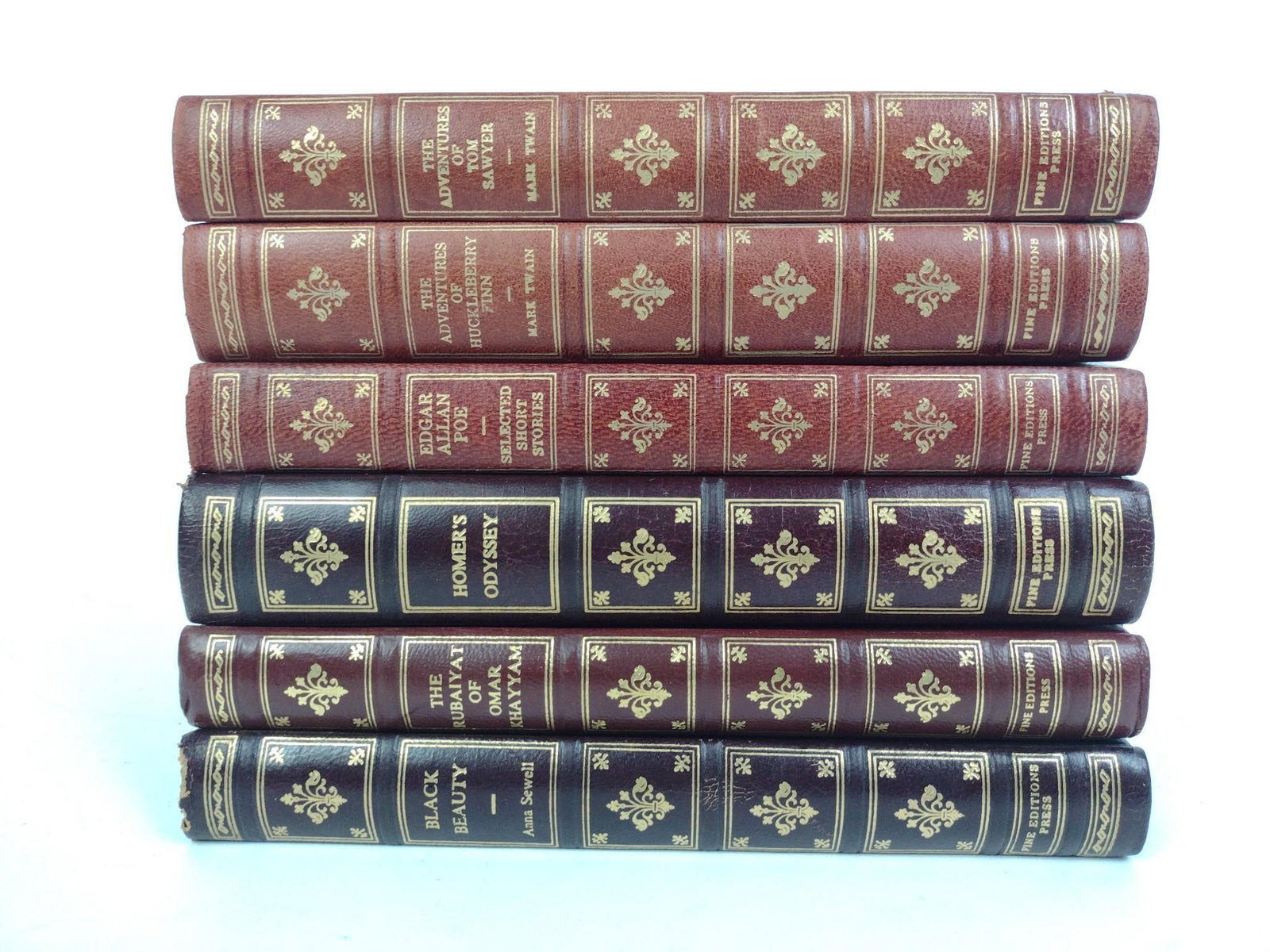 6 "Fine Editions Press" Books: Includes The Adventures of Tom Sawyer, The Adventures of Huckleberry Finn, Edgar Allen Poe (Selected Short Stories), Black Beauty, Homer's Odyssey, and The Rubaiyat of Omar Khayyam. All