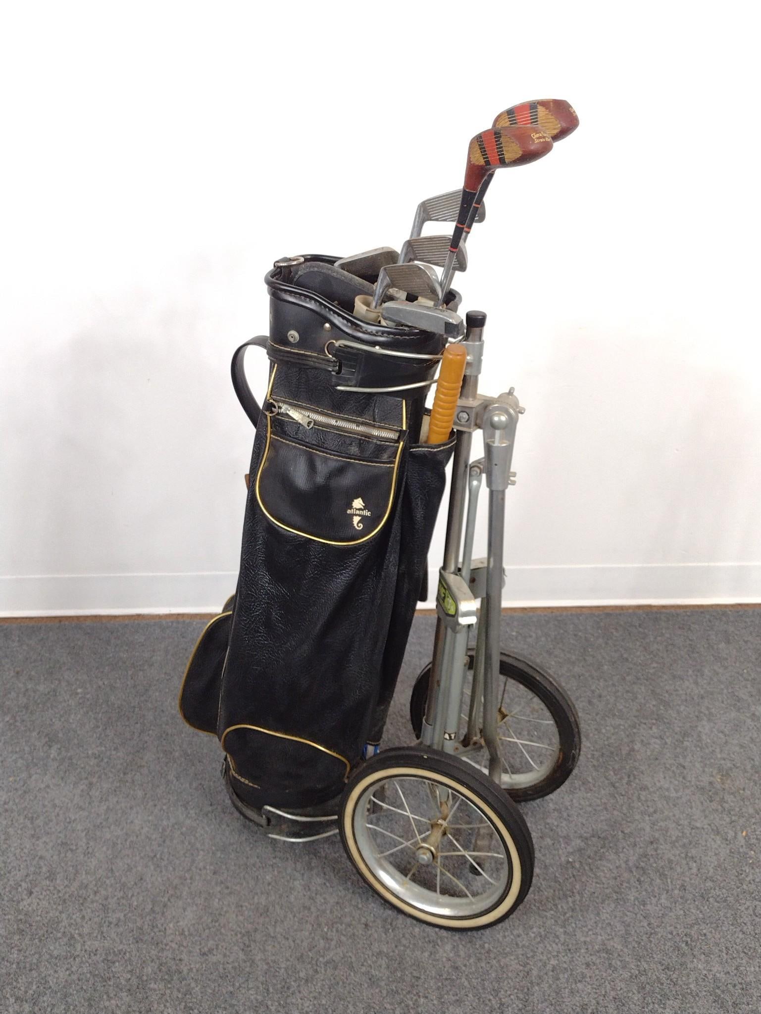 Vintage Golf Set: Includes golf bag holder, golf bag, and various golf clubs. Wear and tear consistent with age and use. 43-1/2"