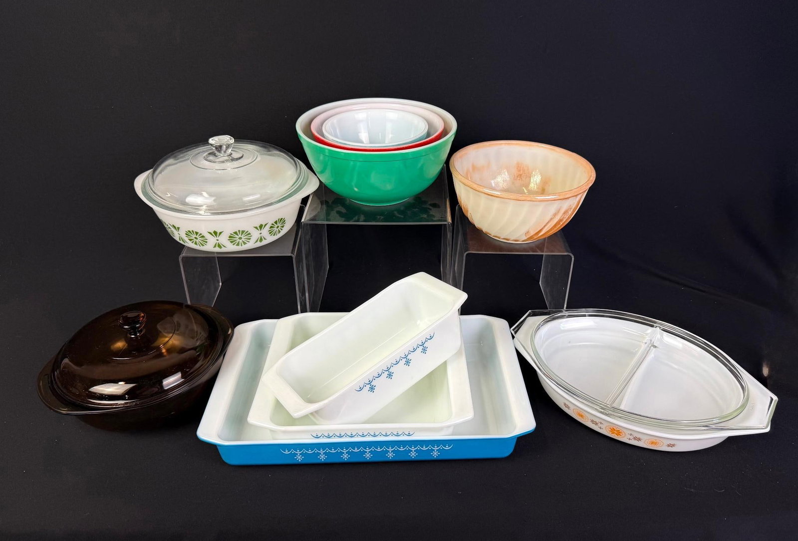 Assorted Glass Serving Dishes: Includes numerous Pyrex containers and dishes, and a Glassbake dish. All in fair condition for age and use. Smallest piece measures 5-3/4": largest piece measures 15-1/4"