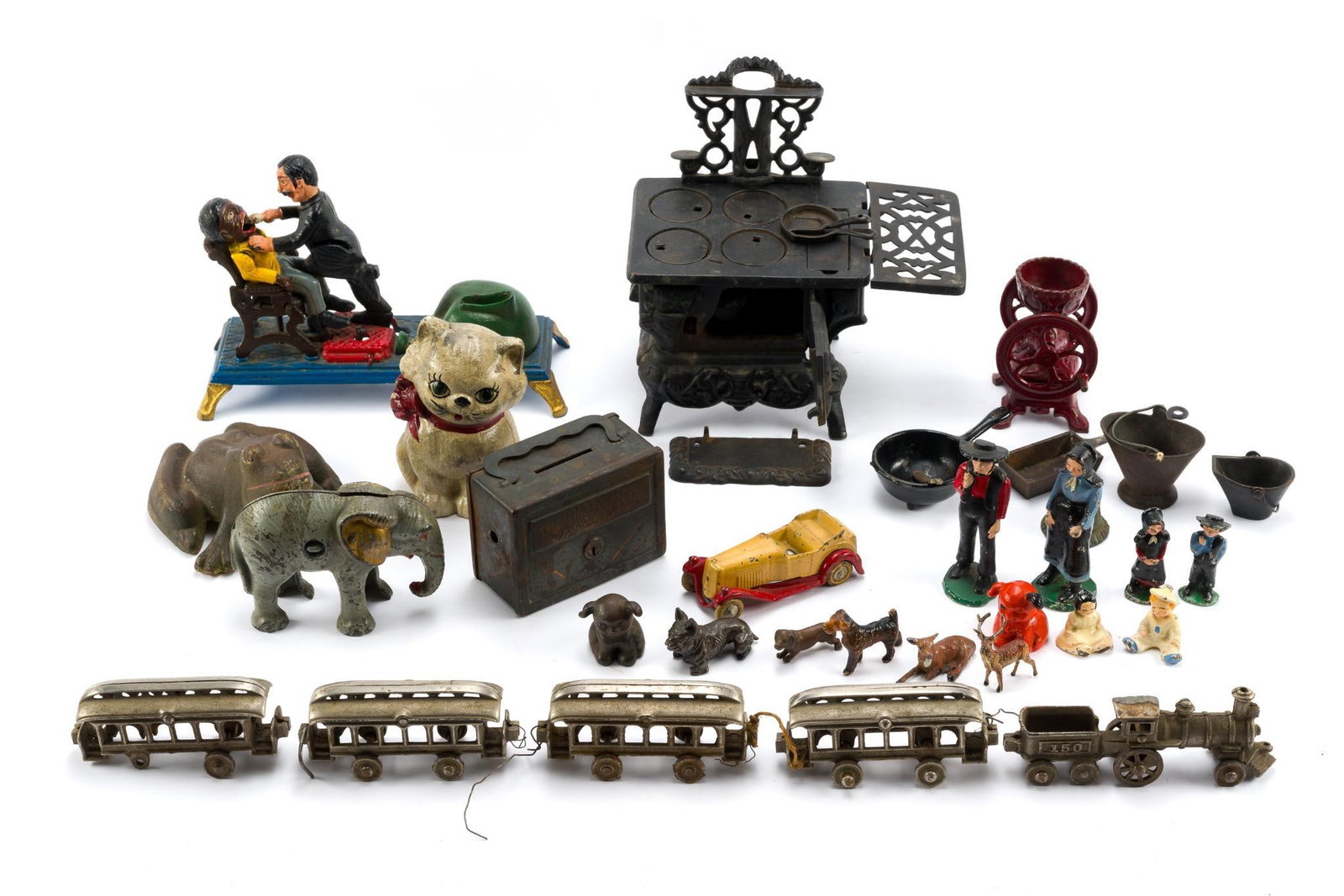 Cast Iron Banks, Toys, and Figures: Includes a mechanical dentist bank, a kitty bank, an elephant bank, a 4-car train, a frog, mini cast iron figures, a stove, and more. All in good condition consistent with age and use. The smallest it