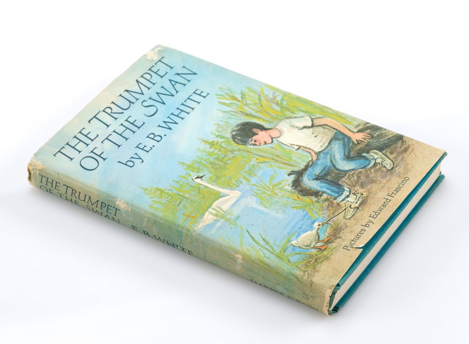First Edition of The Trumpet of the Swan by E. B. White: Pictures by Edward Franscino. 1970 edition. With some wear to the dust jacket consistent with age and use, but overall in good condition. Measures 8-1/4" x 5-1/2". 