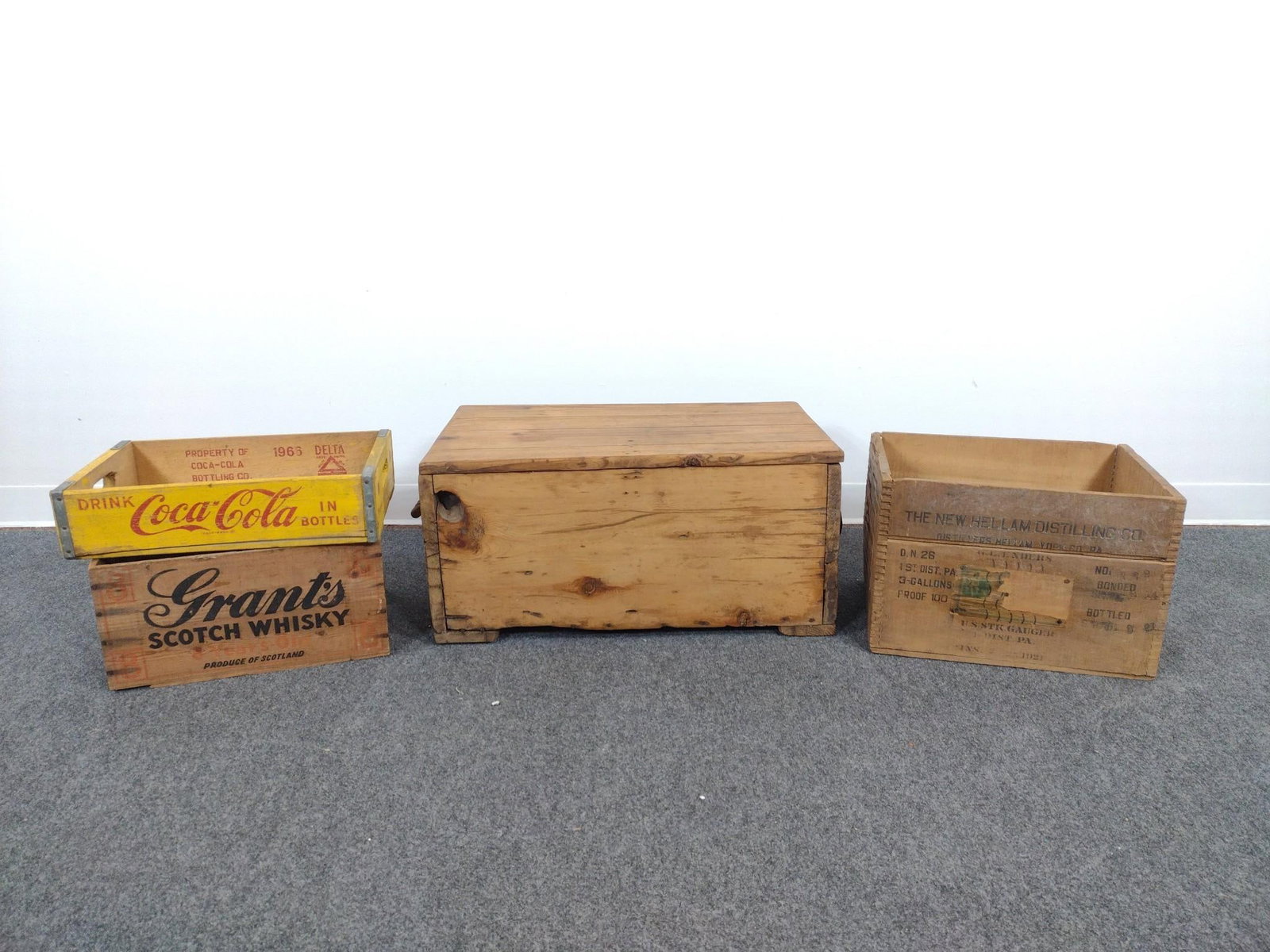 4 Antique Wood Crates Incl. Coca-Cola: Also includes antique blanket chest with rope handles, lid does not appear to be original, a York Valley Rye Whiskey wooden box, a Coca-Cola wooden flat, and a W.M. Grant & Sons Distillery box.