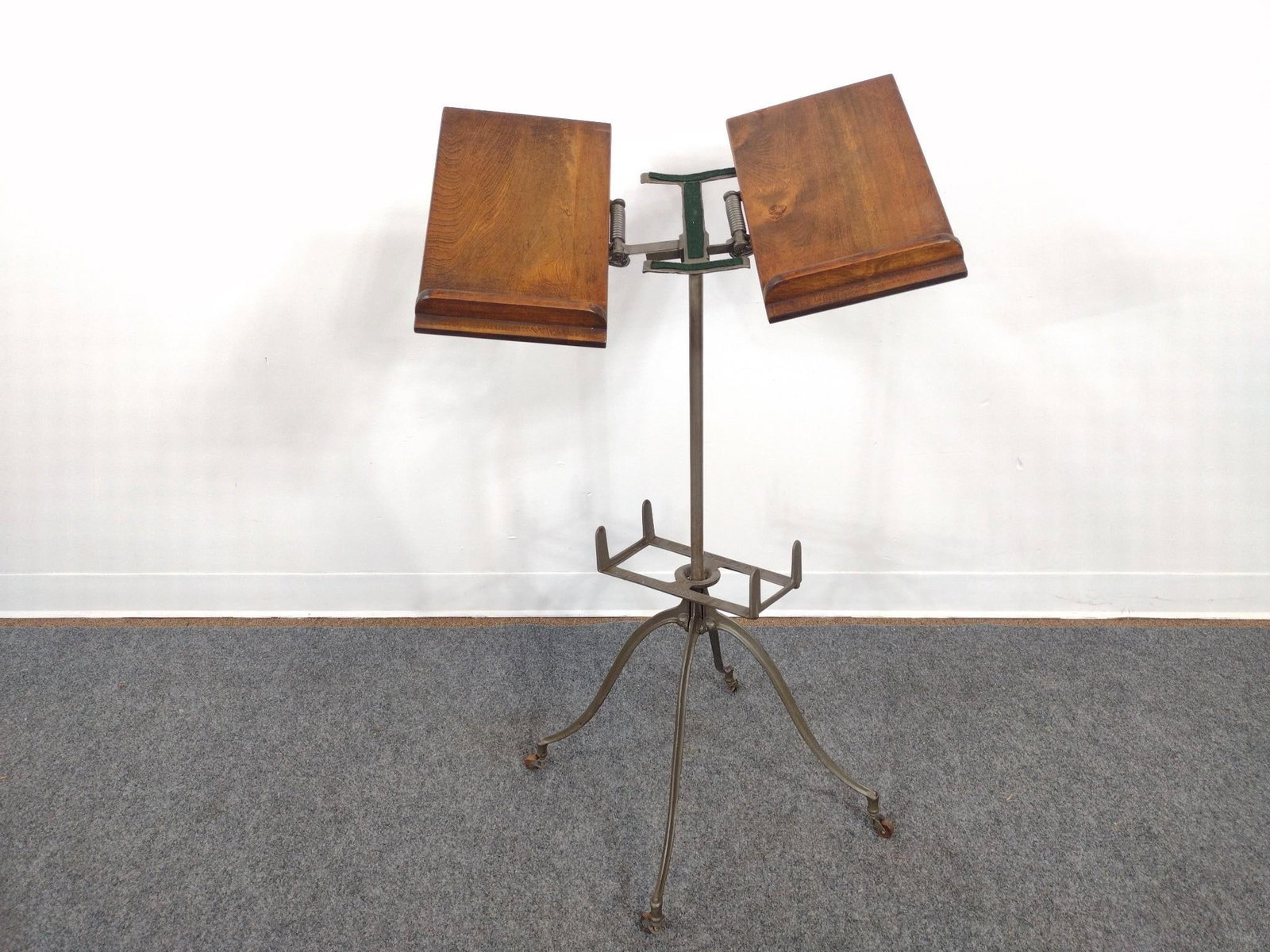 Victorian-Style Bible Stand & 20th C. Wrought Iron Lamp: 20th C. wrought iron and brass double arm bridge lamp with two light sockets and 2 hanging decorations. Bible stand manufactured by Geo J. Flanagan of Chicago, IL. Bible stand measures 16" x 16" 