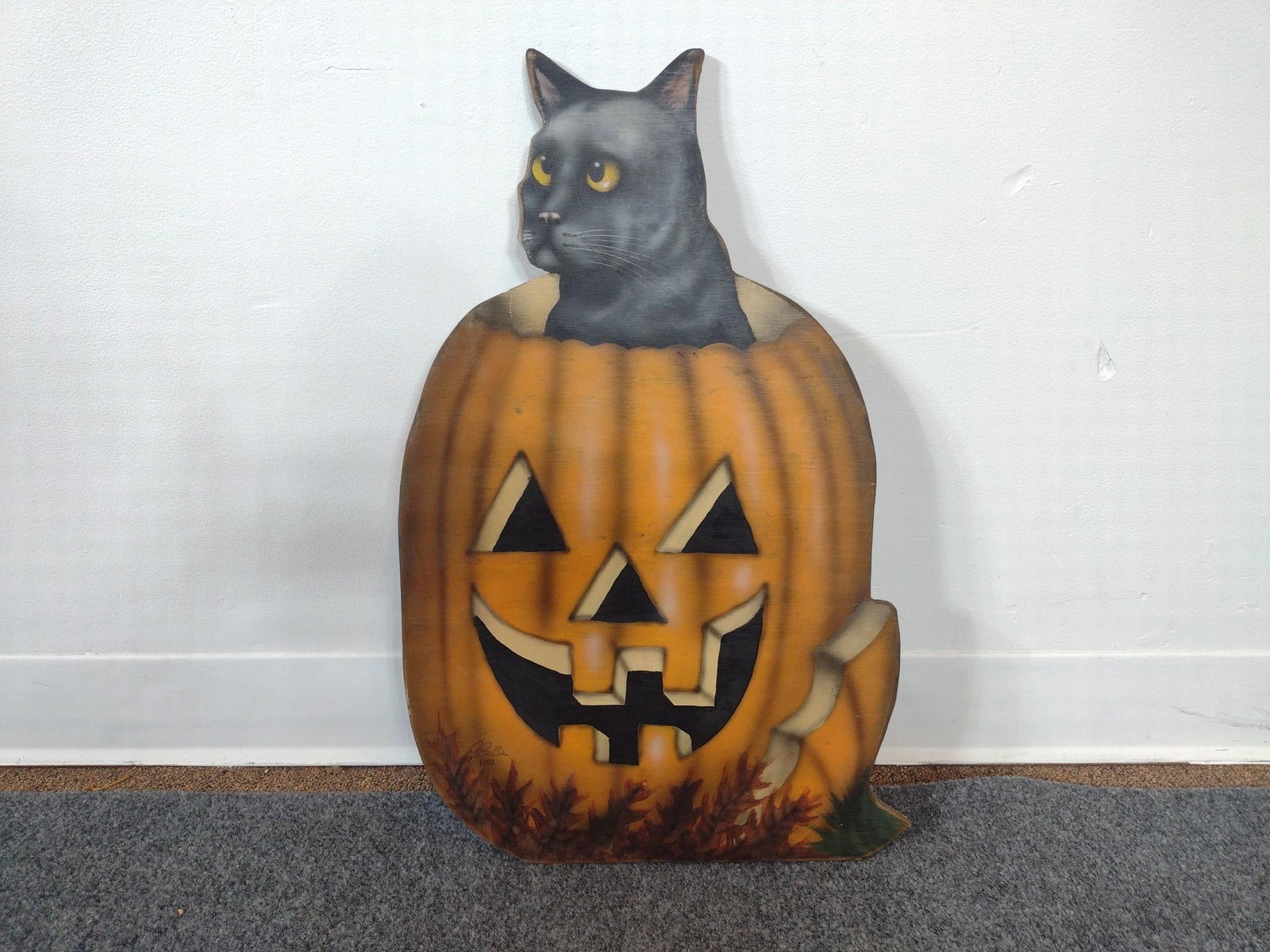 Pumpkin Cat Halloween Decoration: Cat sitting in a pumpkin painted on wood. Back marked "Boardwalk Originals 1991." 13-1/4" wide x 21-1/4" high. 