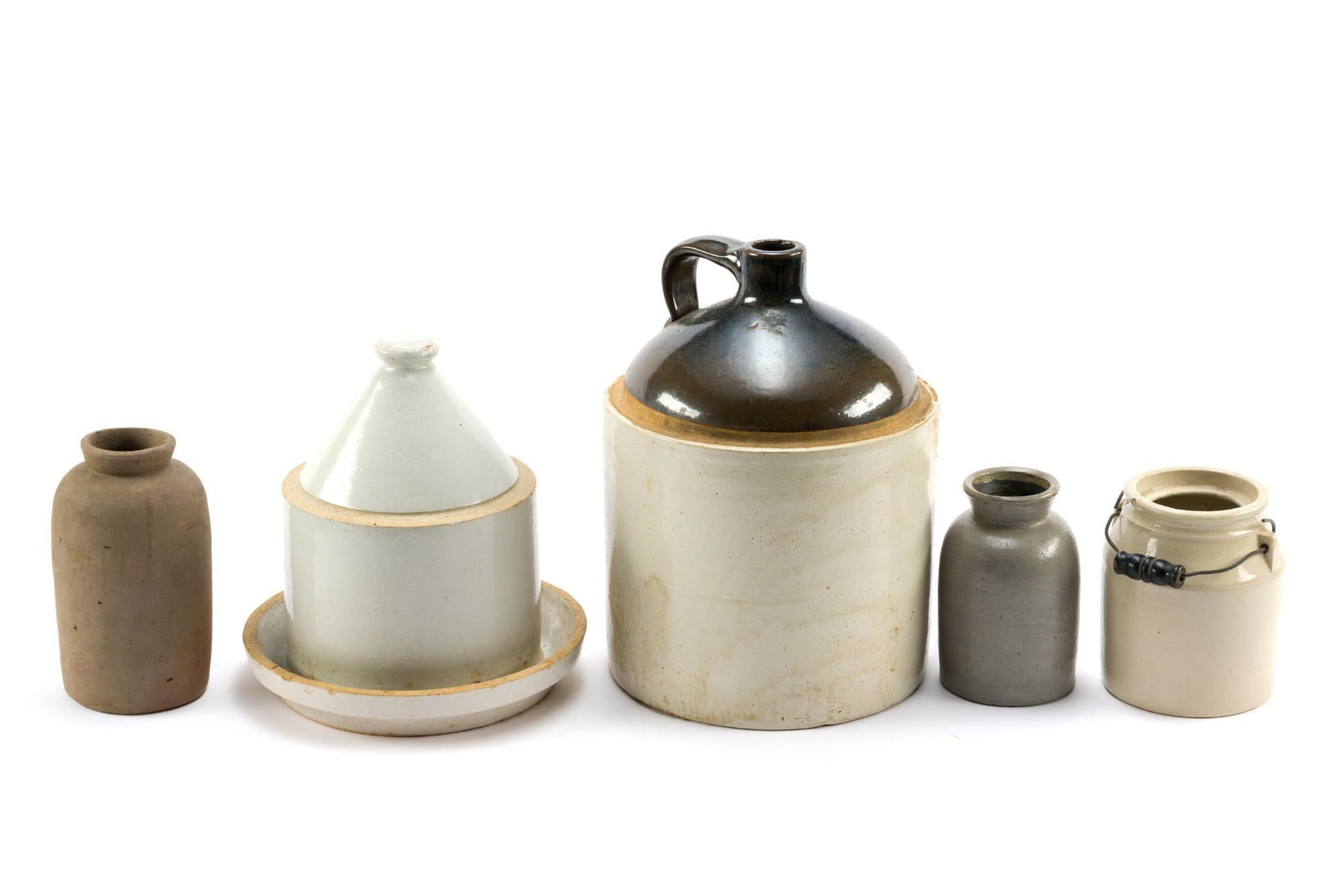 Unmarked Stoneware: Includes whiskey jug, crocks, and saucer. All in fair condition for age. Smallest piece measures 5-3/4"; largest measures ~12-1/2". 