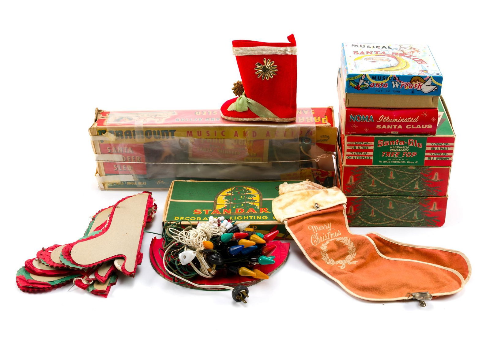Vintage Christmas Decorations Incl. Santa-Glo: Includes Noma Illuminated Santa Claus, Musical Santa Wreath, Paramount Music & Action, 3 Santa-Glo, and more. All with wear consistent with age and use. Santa-Glo's measure 8-1/2". 