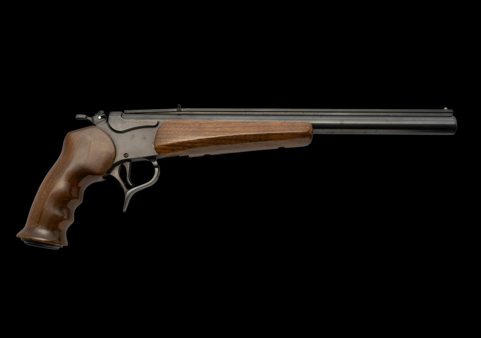 Thompson-Center Contender Pistol, Cal. 45 Colt-.410: Serial No. G11232 This Thompson-Center Contender is fitted with a 14" heavy barrel chambered for .45 Colt cartridges and .410 bore shotgun shells. It is in near-new condition; tiny scuffs on handle,