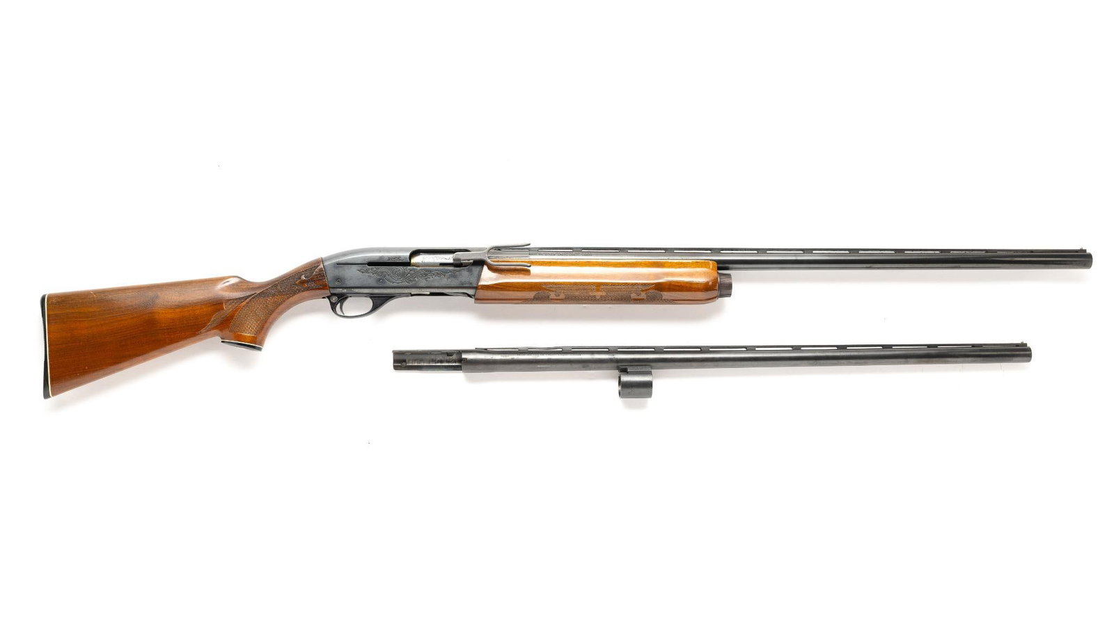 Remington Model 1100 Pump Action Shotgun, Cal. 12 Ga: Serial No. L474981V Classic American autoloading shotgun, the Remington Model 1100 revolutionized the sporting shotgun market with its reliable gas-operated action and reduced felt recoil. Introduced 