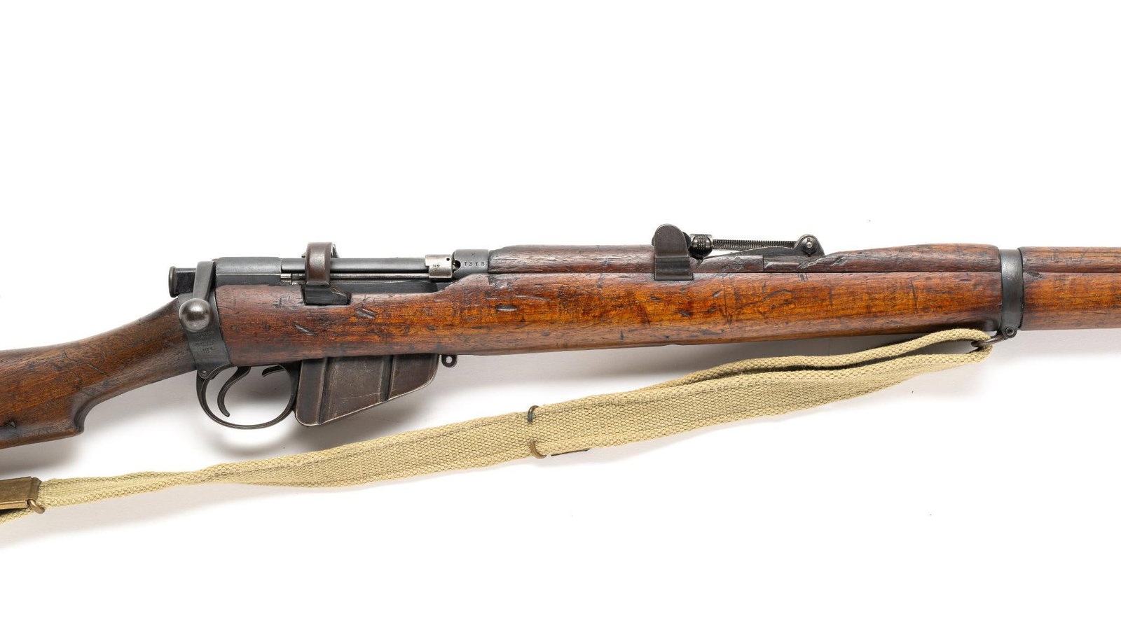 British Enfield No. 1, MKIII Bolt Action Military Rifle, Cal. .303: Serial No. 1315 The Enfield No. 1, MKIII SMLE (Short Magazine Lee-Enfield) served as the primary battle rifle from 1895 through WWI and remained in service throughout WWII. Bolt action. Feeds from a d