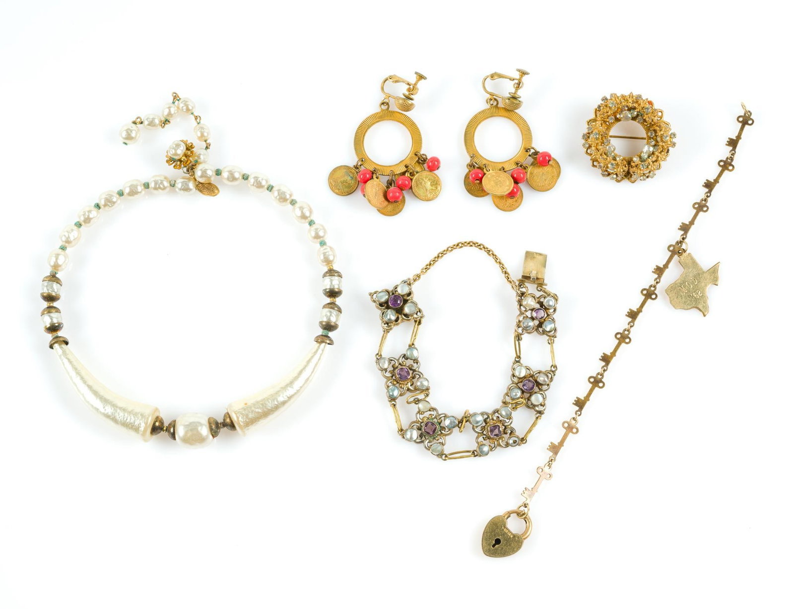 Jewelry Incl. Miriam Haskell: Also includes a Victorian bracelet and gold-filled charm bracelet with heart lock. Largest piece measures 4" in length and the smallest piece measures approximately 1-1/2" in diameter. Provenanc