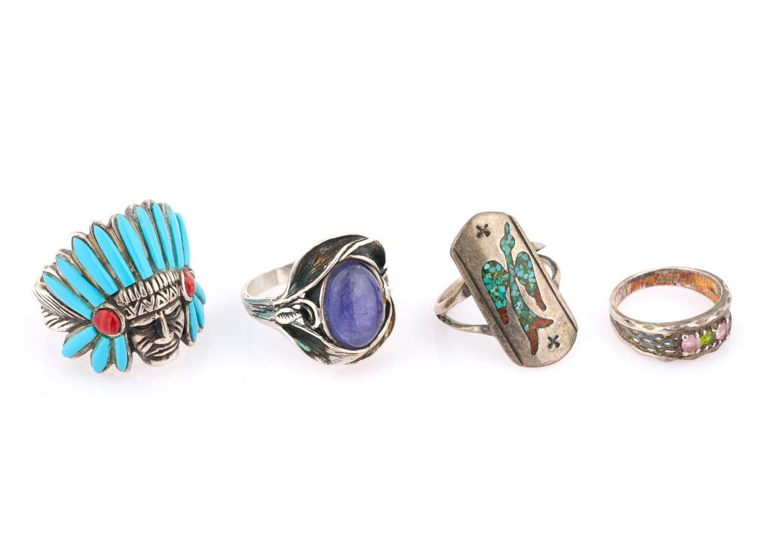 4 Sterling Silver Southwestern Rings: Includes Native American chief statement ring with turquoise and coral, sugilite cabochon, Zuni shield, and multi gemstone. Ring sizes 6.5 to 12.5. 1.31 ozt total. 