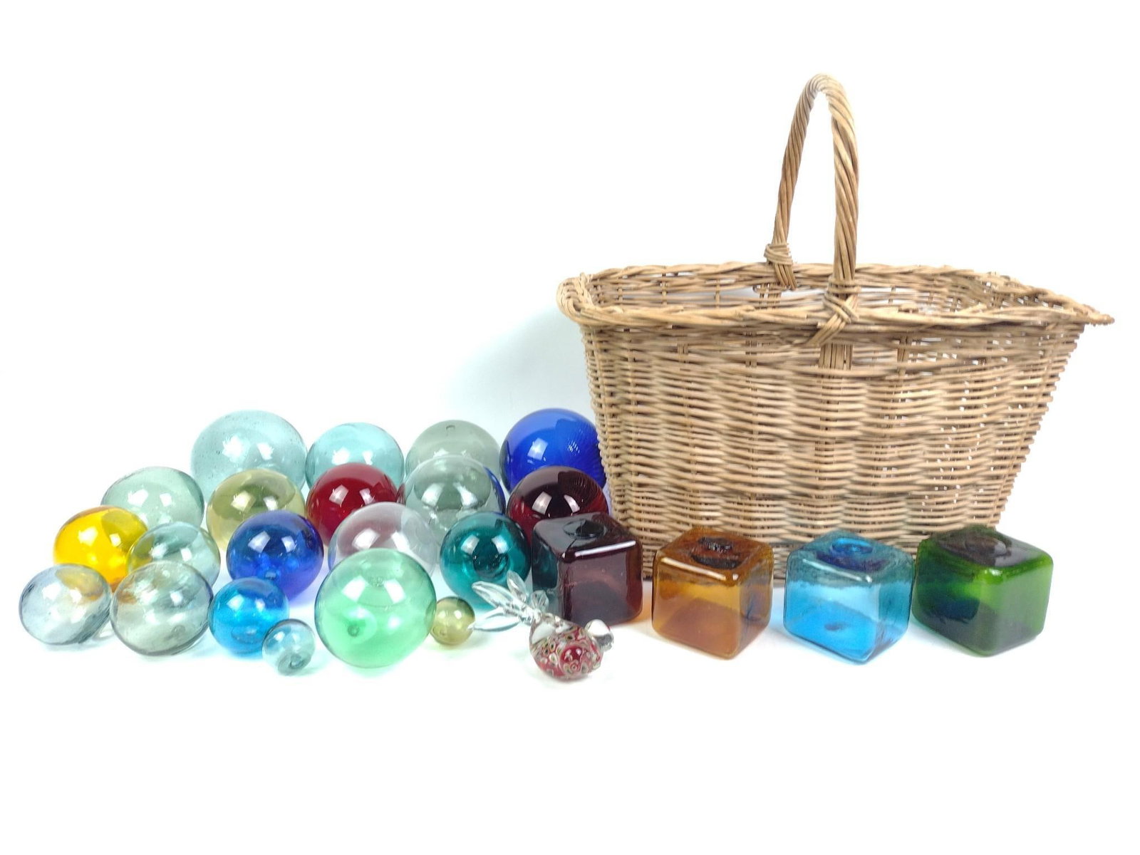24 Hand-Blown Glass Fishing Floats: Also includes an art glass fish and wicker basket. Largest glass float measure approximately 4" to 5" in diameter.
