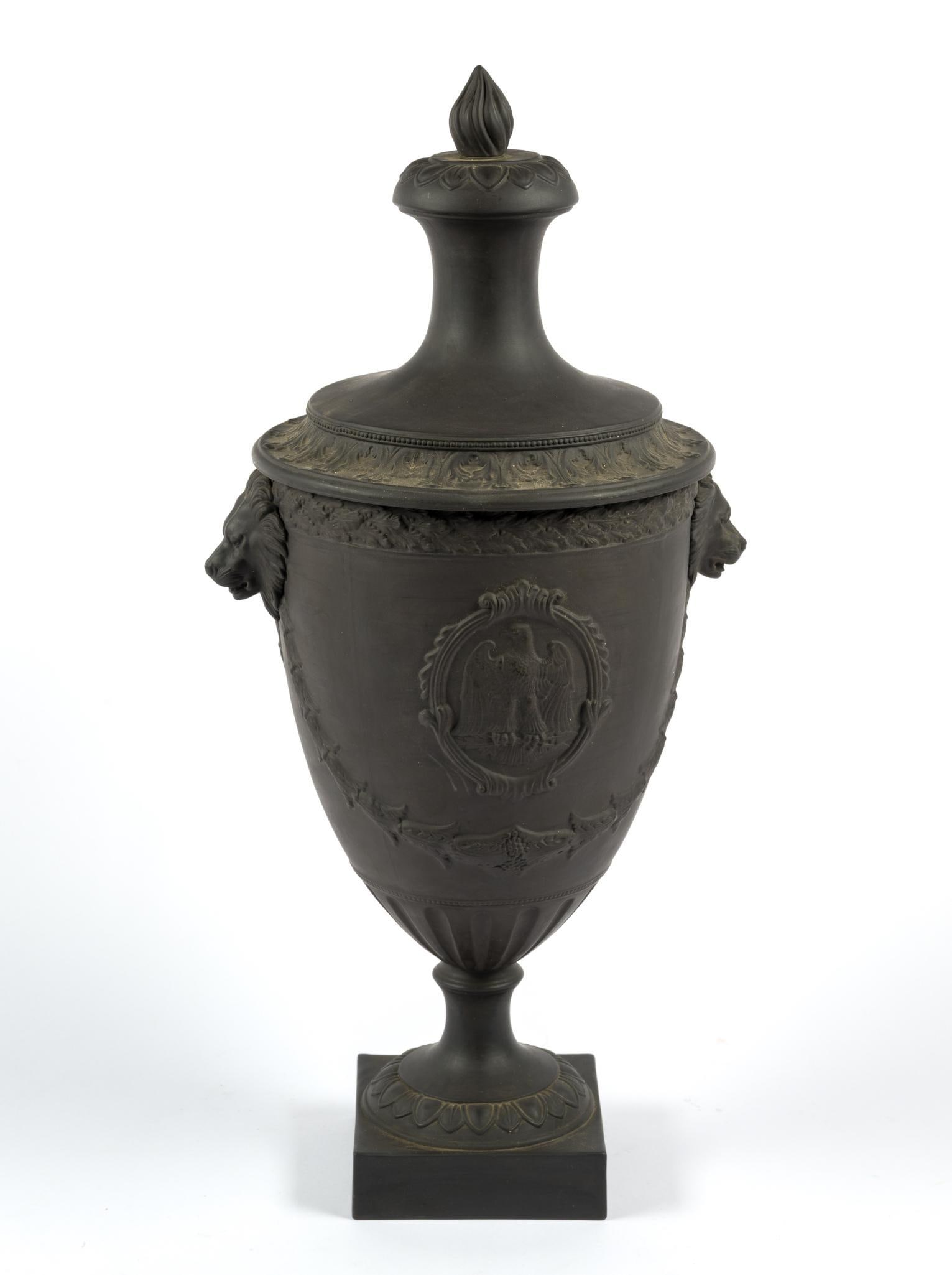 Neoclassical Covered Urn: With lion head handles and eagle motif. 11" wide x 21-3/4" high. 