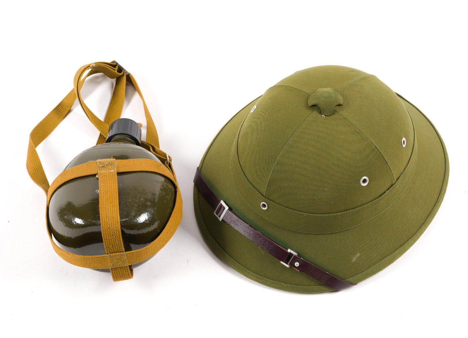 North Vietnamese Helmet & Canteen: Inside of helmet marked "Made in Vietnam." Canteen measures 5-1/2" wide x 7-1/2" long. Hat measures 10-1/4" wide. 