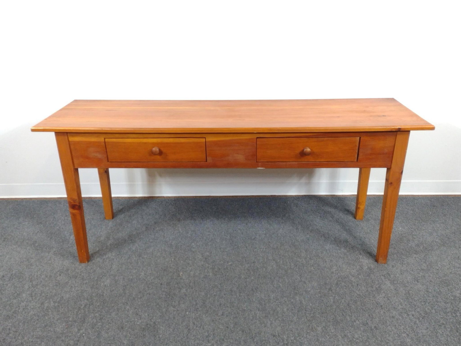 Paul Hardy Jr Hand Crafted Two Drawer Sofa Table: 69" wide X 20" deep X 29" high. Front has some finish loss. Provenance: Living in a log cabin in the woods is the perfect setting for a man who has always loved and tinkered with wood. After