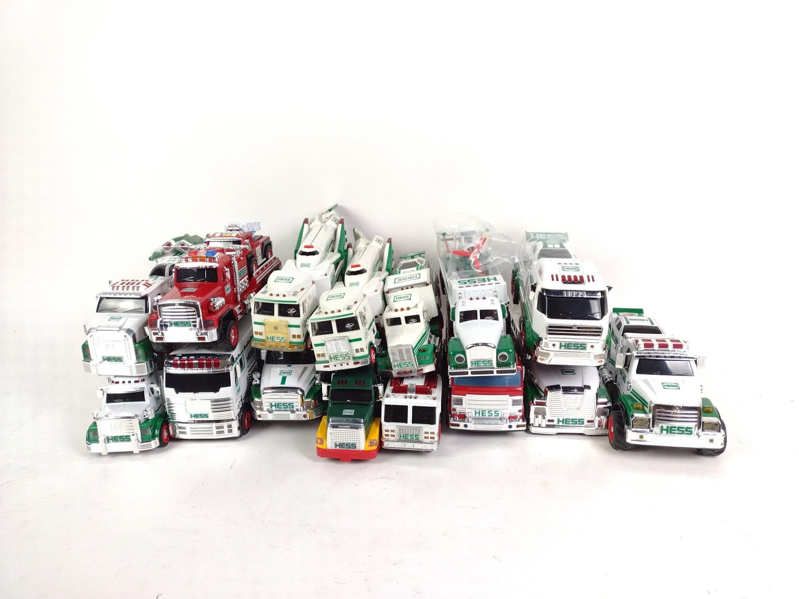 15 Hess Trucks: No boxes. Largest measures 12" x 4-1/2" x 6".