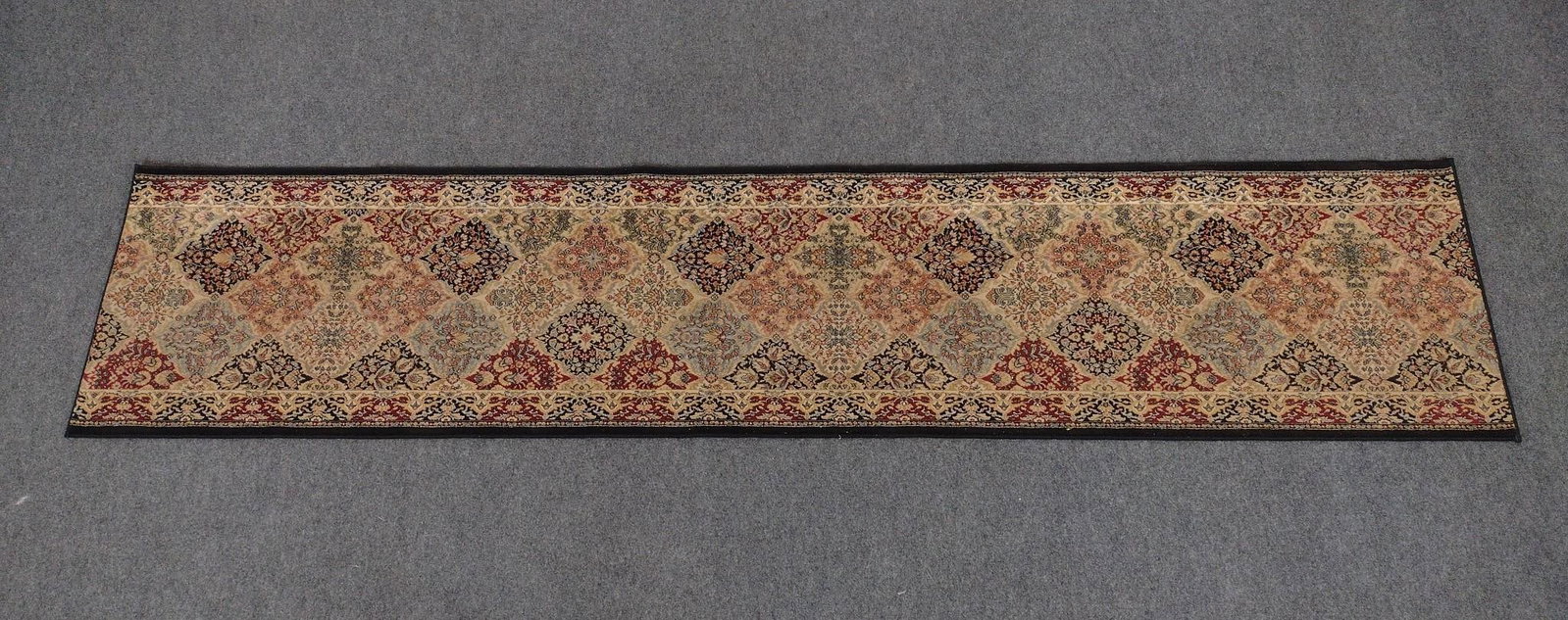 Oriental Style Runner Rug: 12" long X 2'7" wide. No manufactures name found.