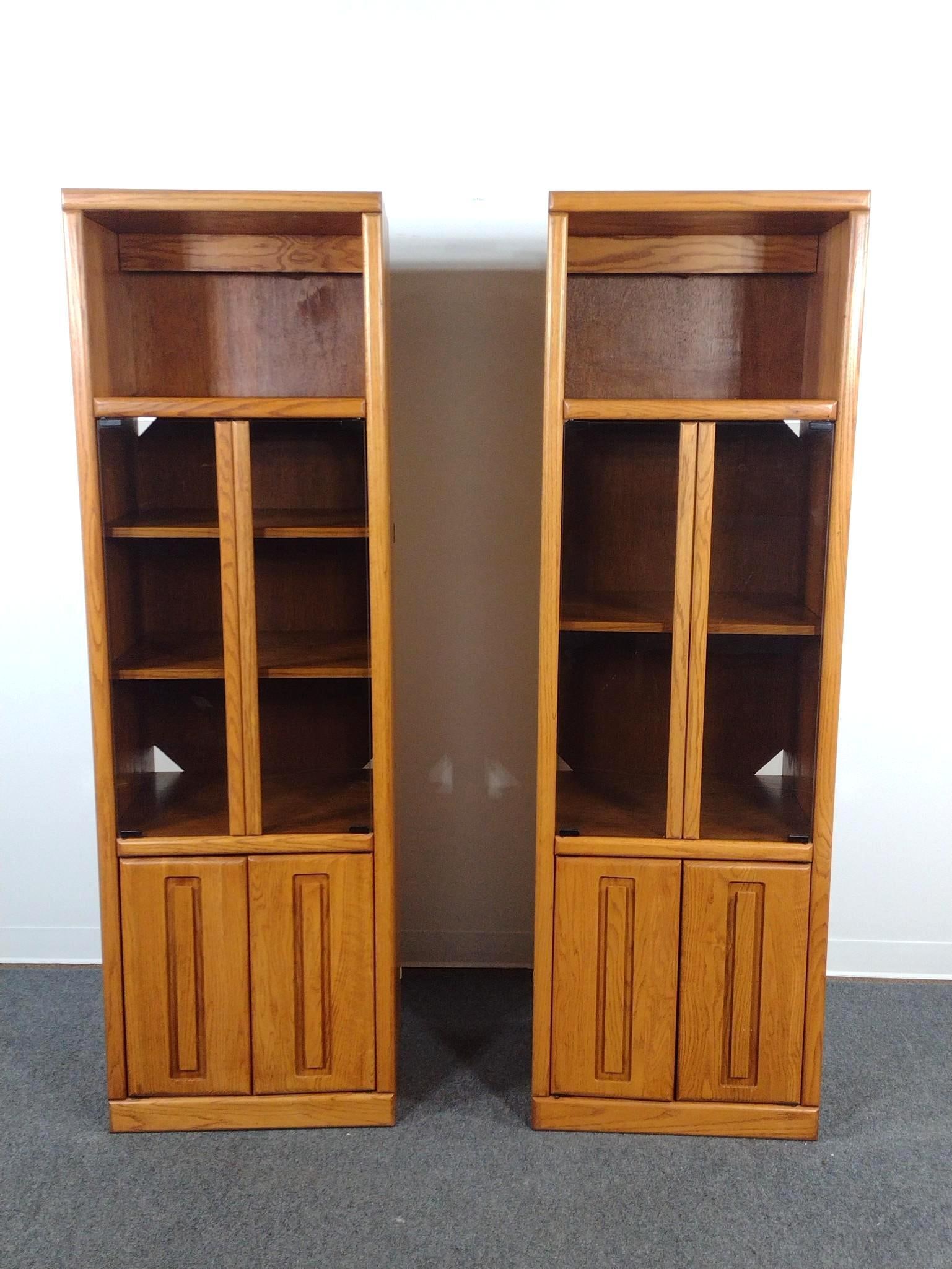 Pair of Oak Media Piers or Display Cabinets: Bookcase or stereo towers. Each 23-1/2" wide X 20" deep X 75" high. No manufactures name found.