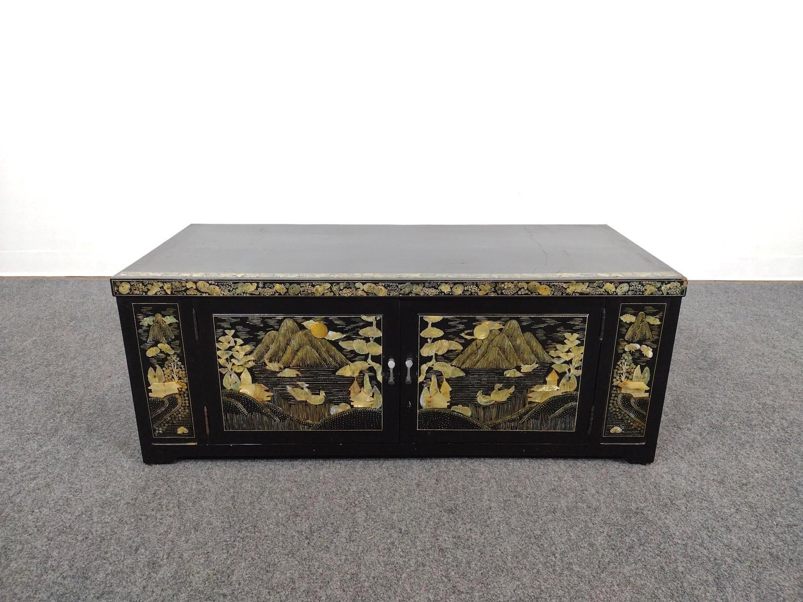 Chinese Chinoiserie Black Lacquer Credenza: 41" wide X 17-3/4" deep X 16" high. Has scratches and finish loss. Top corner has some damage. 
