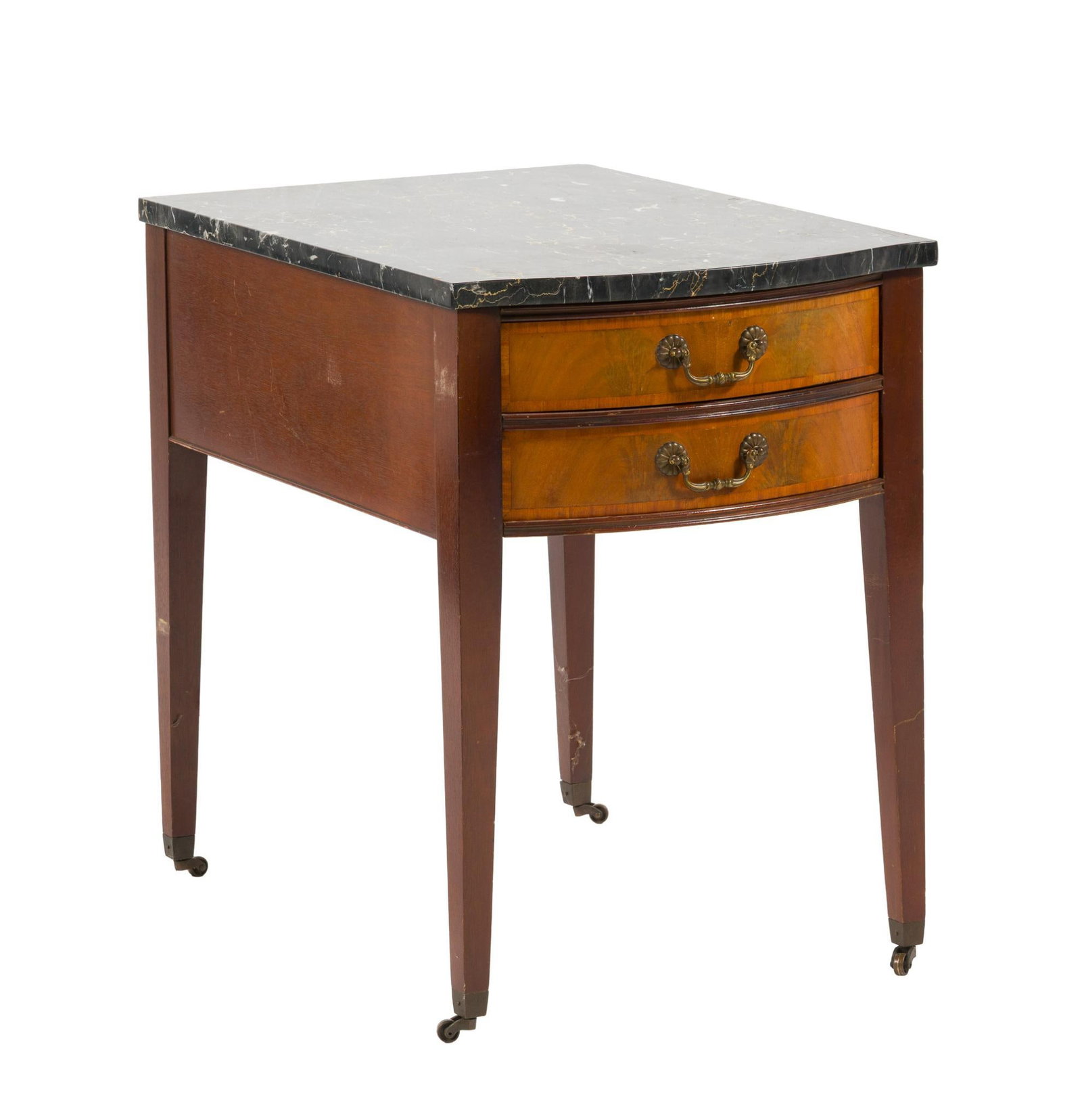 Hepplewhite Style Marble Top Side Table: A 20th century Hepplewhite style marble top serving or side table. Tapered legs resting on brass castors join a mixed wood case with two drawers surmounted by a dark green marble top. Wear consistent
