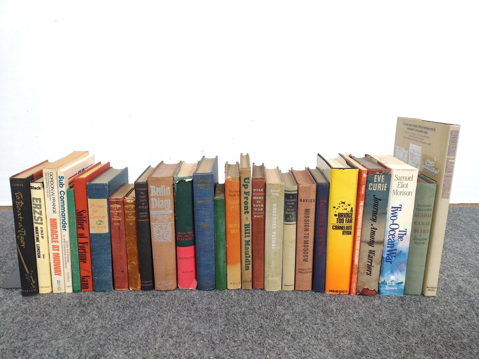 27 Books on World War II: Includes a signed "Erzsi: A Tale of Wartime London" by Andrew Black. Also includes books by "Pappy" Boyington, Ernie Pyle, Eve Curie and more. Largest book measures 8-3/4" x 12". 