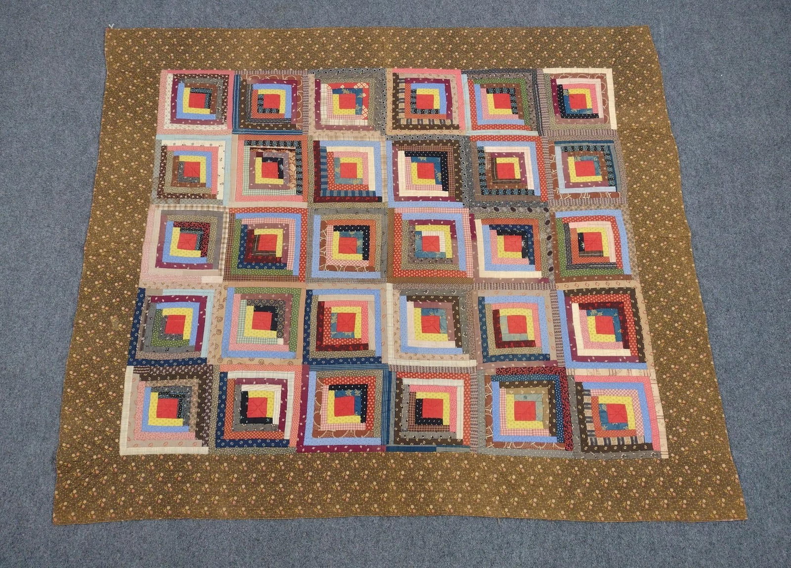 Patchwork Log Cabin Quilt: Late 19th century. 7' long X 6' wide.