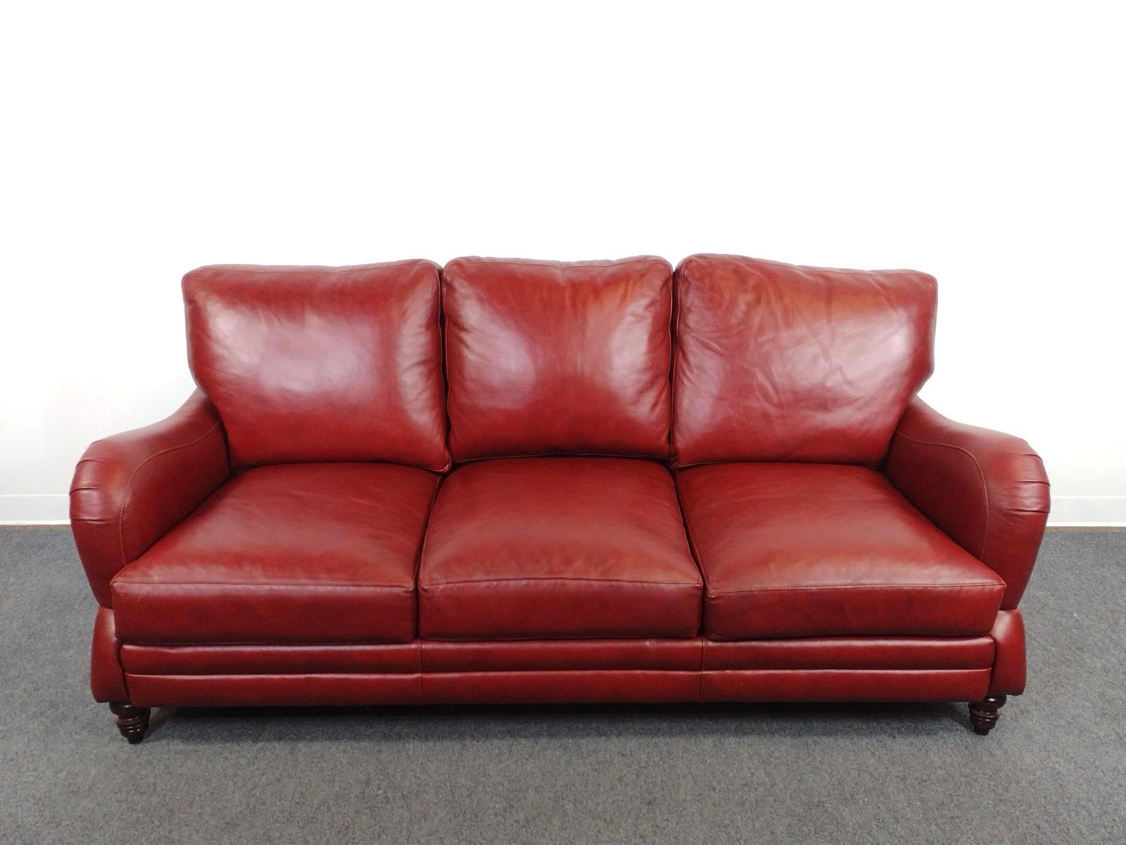 Stickley Red Leather Sofa: 80" wide X 42" deep X 33-1/2" high. One seat cushion has scratches.