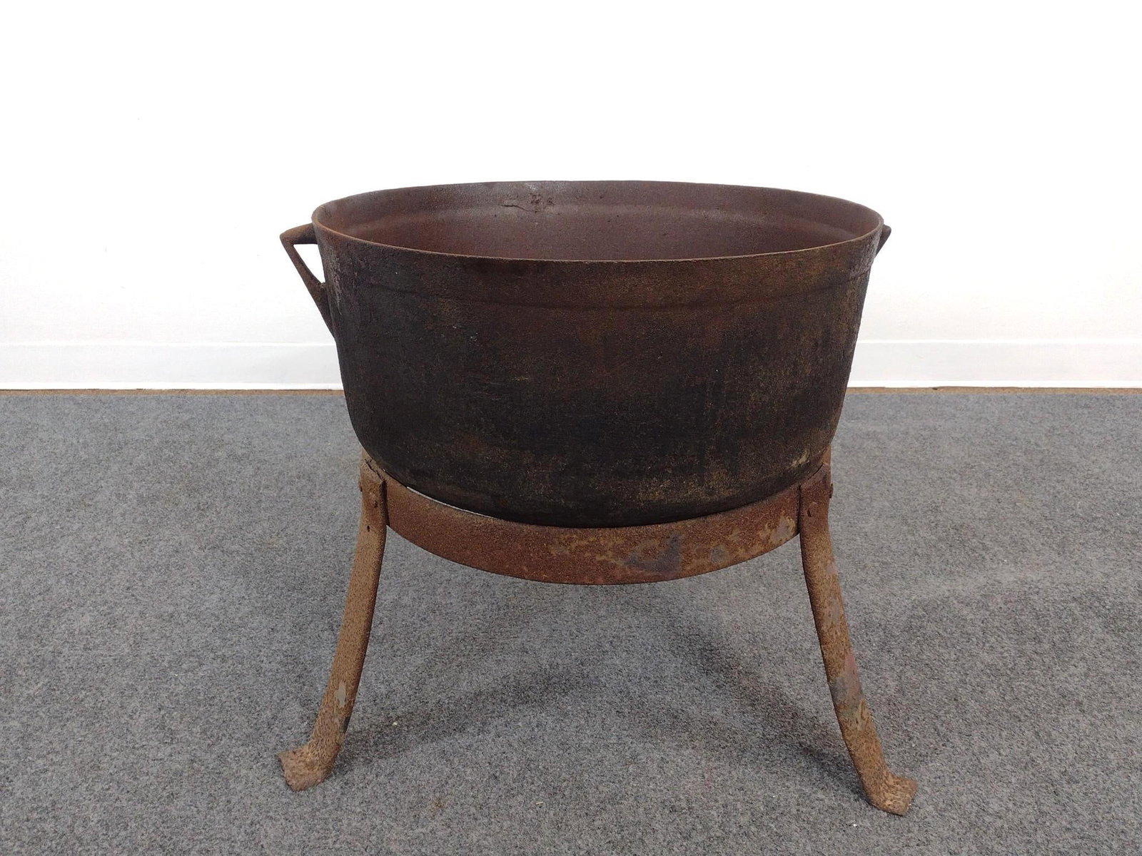 Cast Iron Cauldron On Stand: All together 22-1/2" diameter X 23-1/2" high. Has finish loss and rust 
