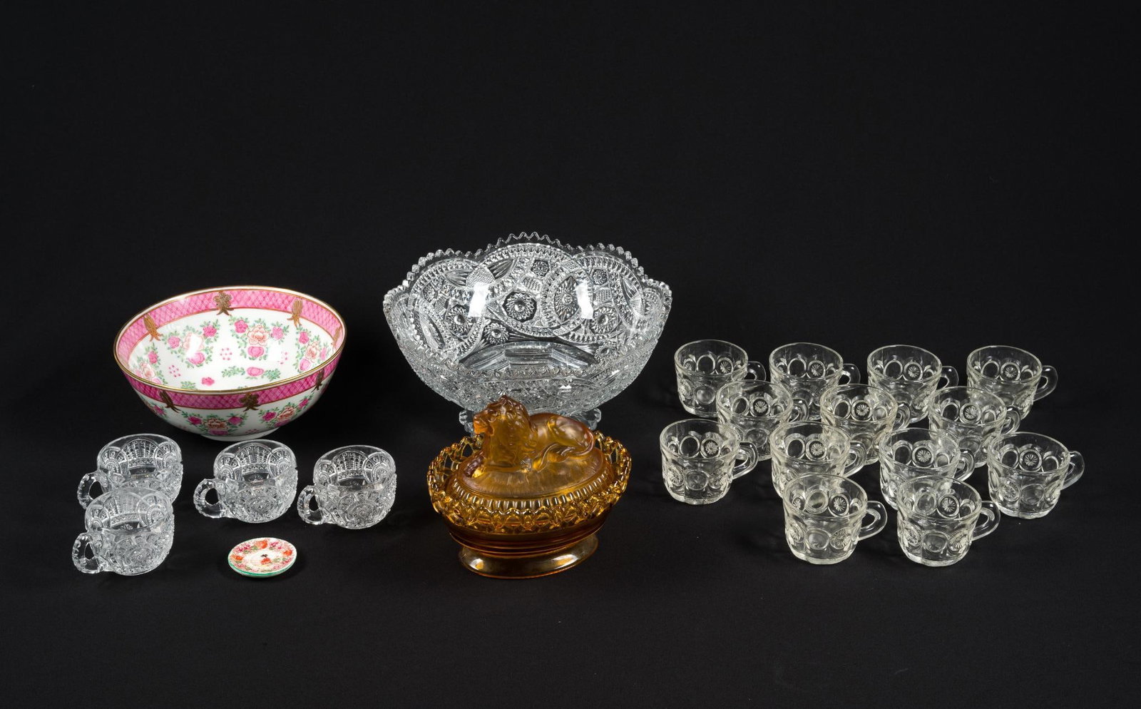 Glass & Porcelain Decoratives Incl. Imperial Glass: Includes an amber glass lion tureen by Imperial Glass, a modern famille Rose bowl, a cut glass punch bowl and cups. Largest piece measures 11-1/2" x 11-1/2" x 5-3/4" and smallest piece measures