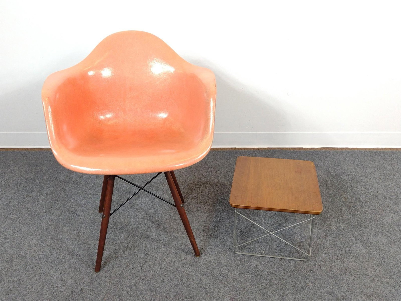 Herman Miller Swivel Chair and Side Table: Chair has sun fading and rust on the bottom. 25" wide X 23" deep X 31" high. Side table has scratches and small areas of loss to top.13-1/4" wide X 15-1/2" deep X 10" high. 