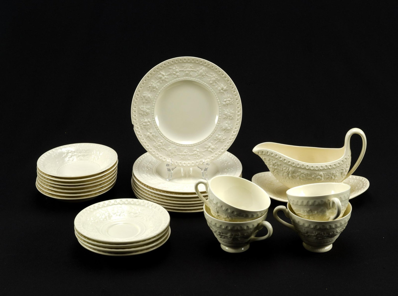 Wedgwood Wellesley Porcelain Dinner Service: Wellesley pattern 93217, Wedgwood of Etruria & Barlaston. The dinner plates are a variation of the Wellesley pattern, Ullswater, with a floral center section. All are ivory porcelain. The set includes