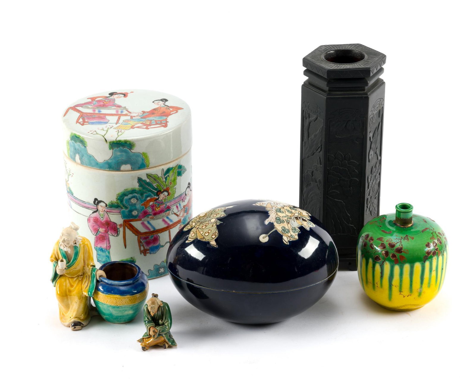 Asian Style Decorative and Ceramics: Includes Famille Rose porcelain jar with lid, 2 Shiwan mudman, 1 Japanese Satsuma porcelain egg, 1 unknown style decorative vase, and a Chinese black slate carved hexagonal vessel. All in good