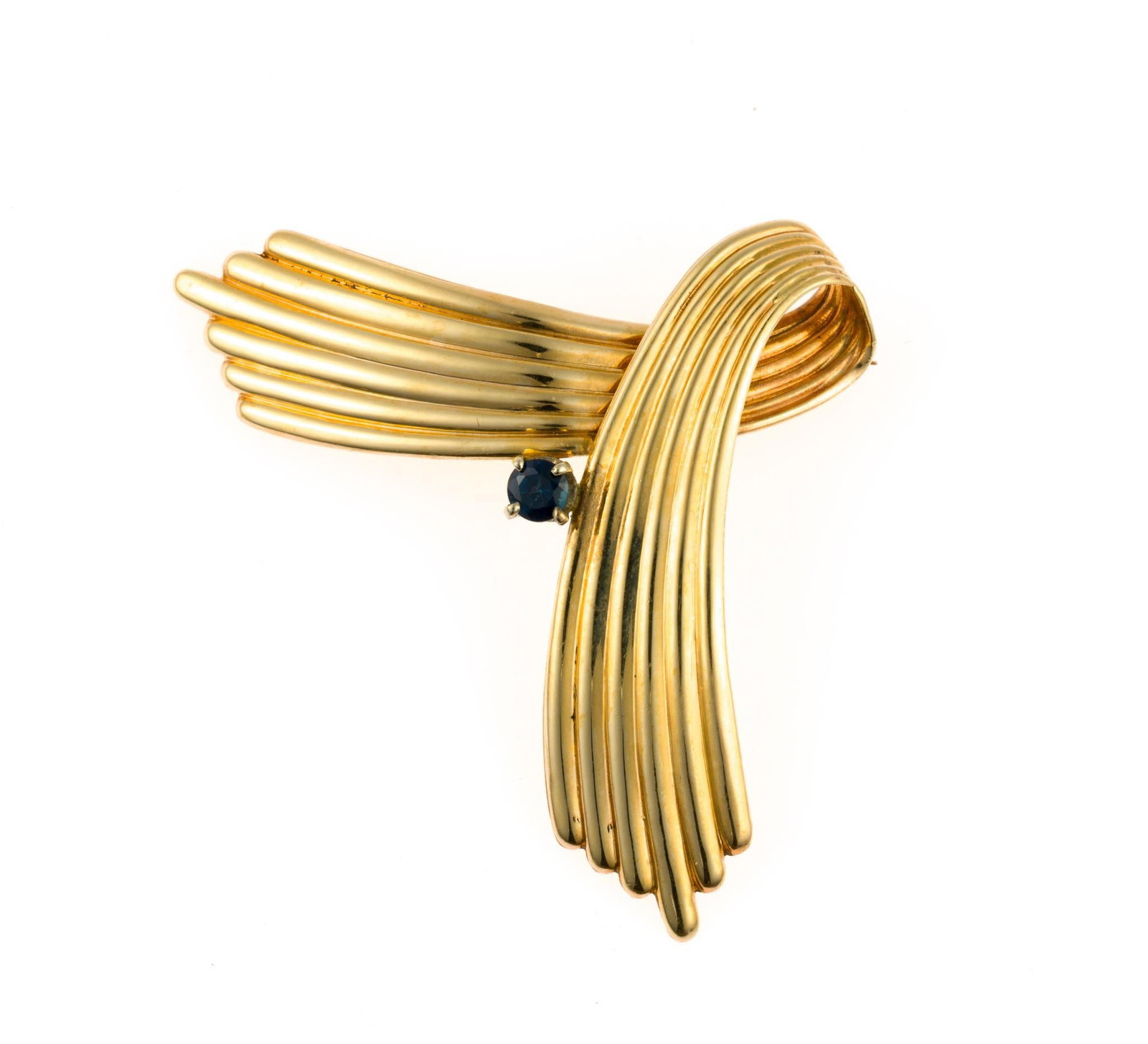 14K Gold and Sapphire Brooch: A vintage yellow gold fan-form brooch with a blue sapphire gemstone enhancement. The width is 2 1/8" and it is marked 14k. The weight is 5.3 grams.