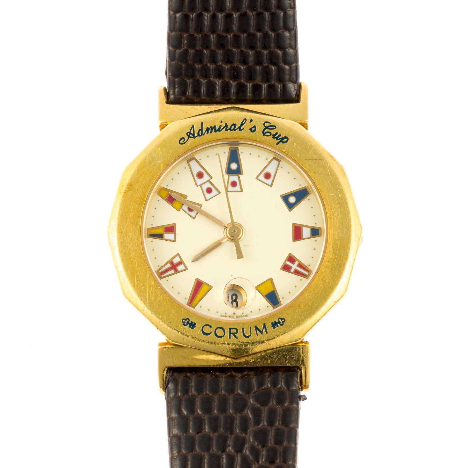 18K Gold Corum Admirals Cup Woman's Wrist Watch: A 26 mm diameter yellow gold Corum model 39.930.56. The watch has a leather strap with the original Corum gold buckle. It fits a 5 1/2" to 7" wrist. The total weight is 33.4 grams. The watch is n