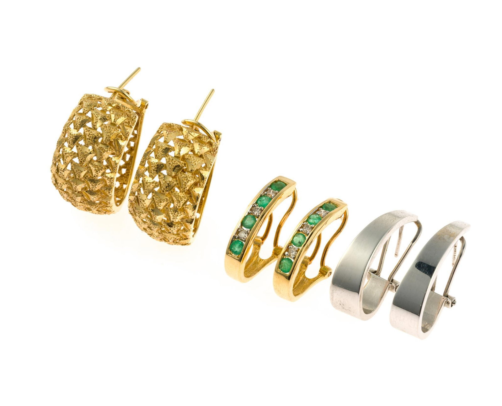 3 Pairs of 14K Gold Earrings: All are hoop designs for pierced ears and have omega backs. One pair is 14k white gold and one pair has emeralds and diamonds. The largest are 1". Total weight is 15.5 grams. All are marked 14k.